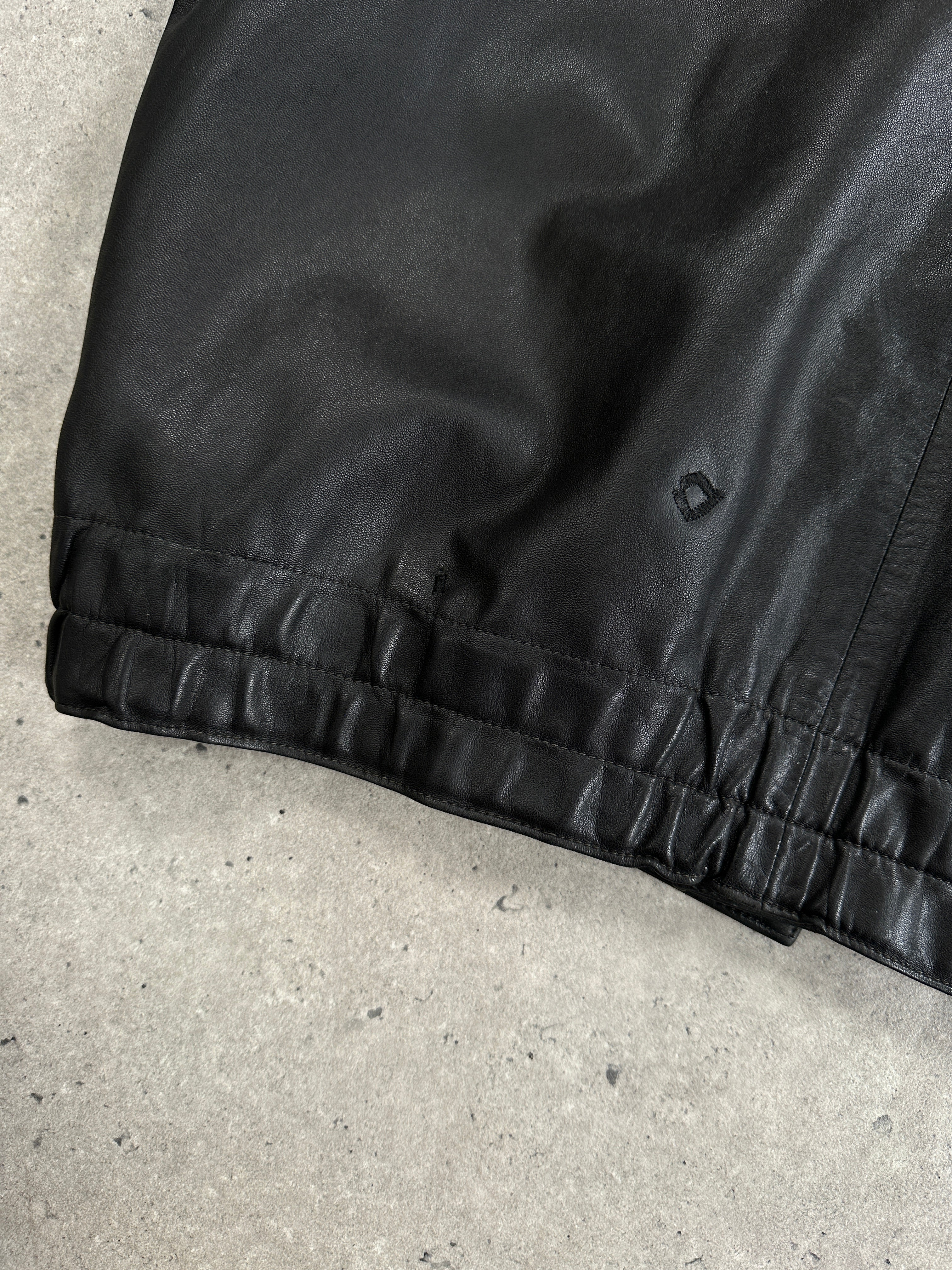 Vintage leather minimal bomber jacket in XL, showcasing classic design with smooth leather and minimal detailing.