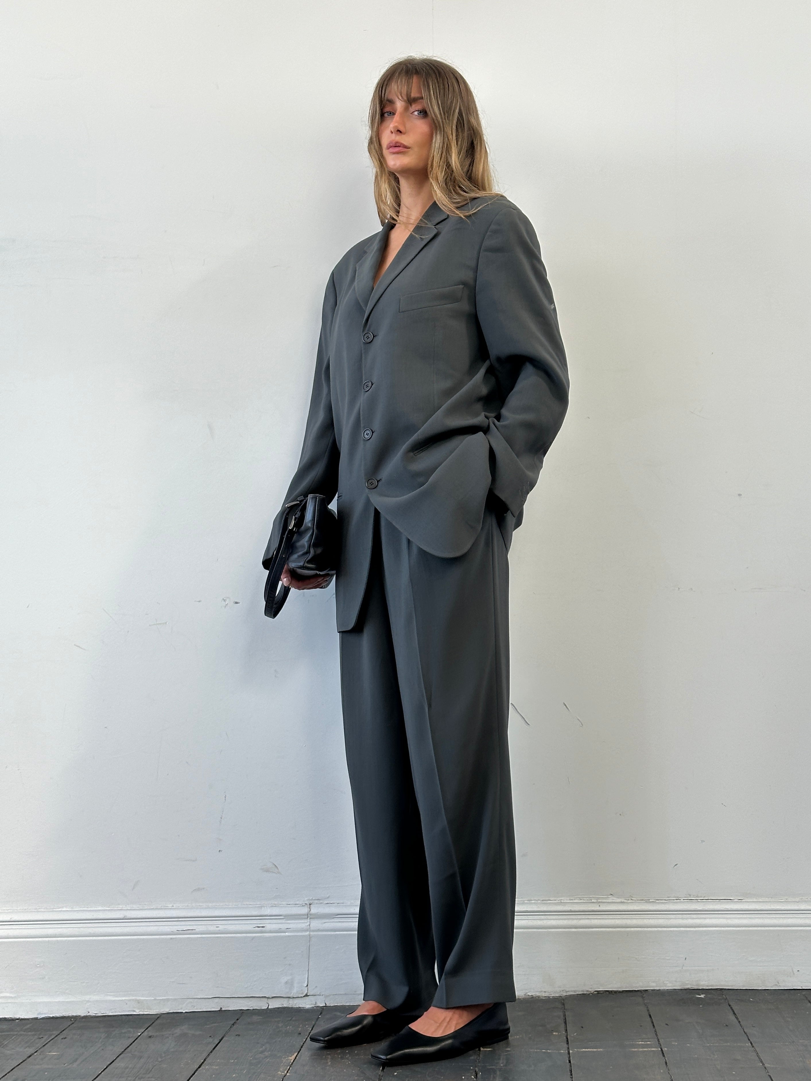 Giorgio Armani Le Collezioni wool relaxed single-breasted suit jumpsuit in size 42R/W34, tailored fit with classic lapels.