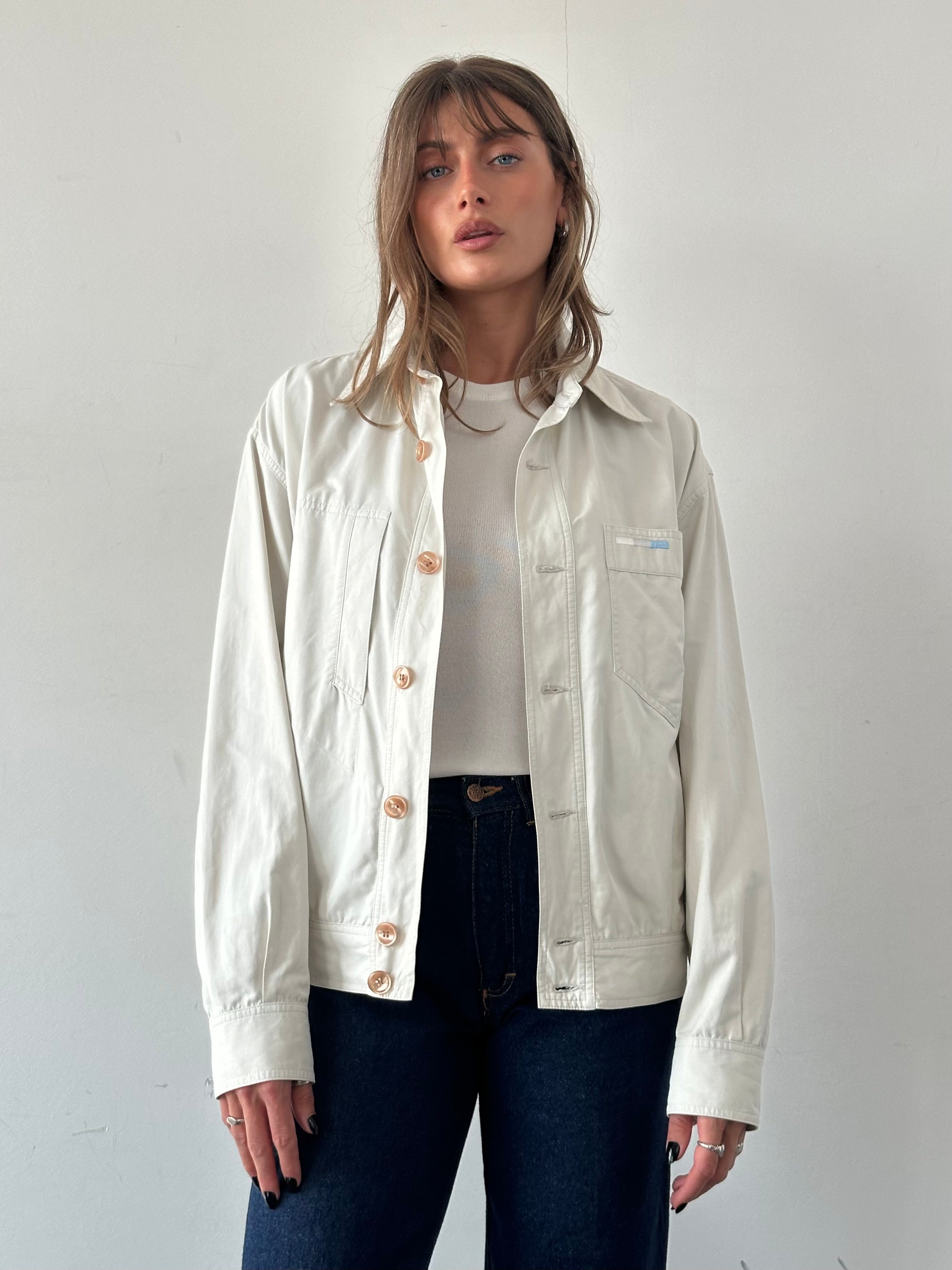 Iceberg button-up bomber jacket in black, featuring a classic design with ribbed cuffs and collar, shown on a hanger.