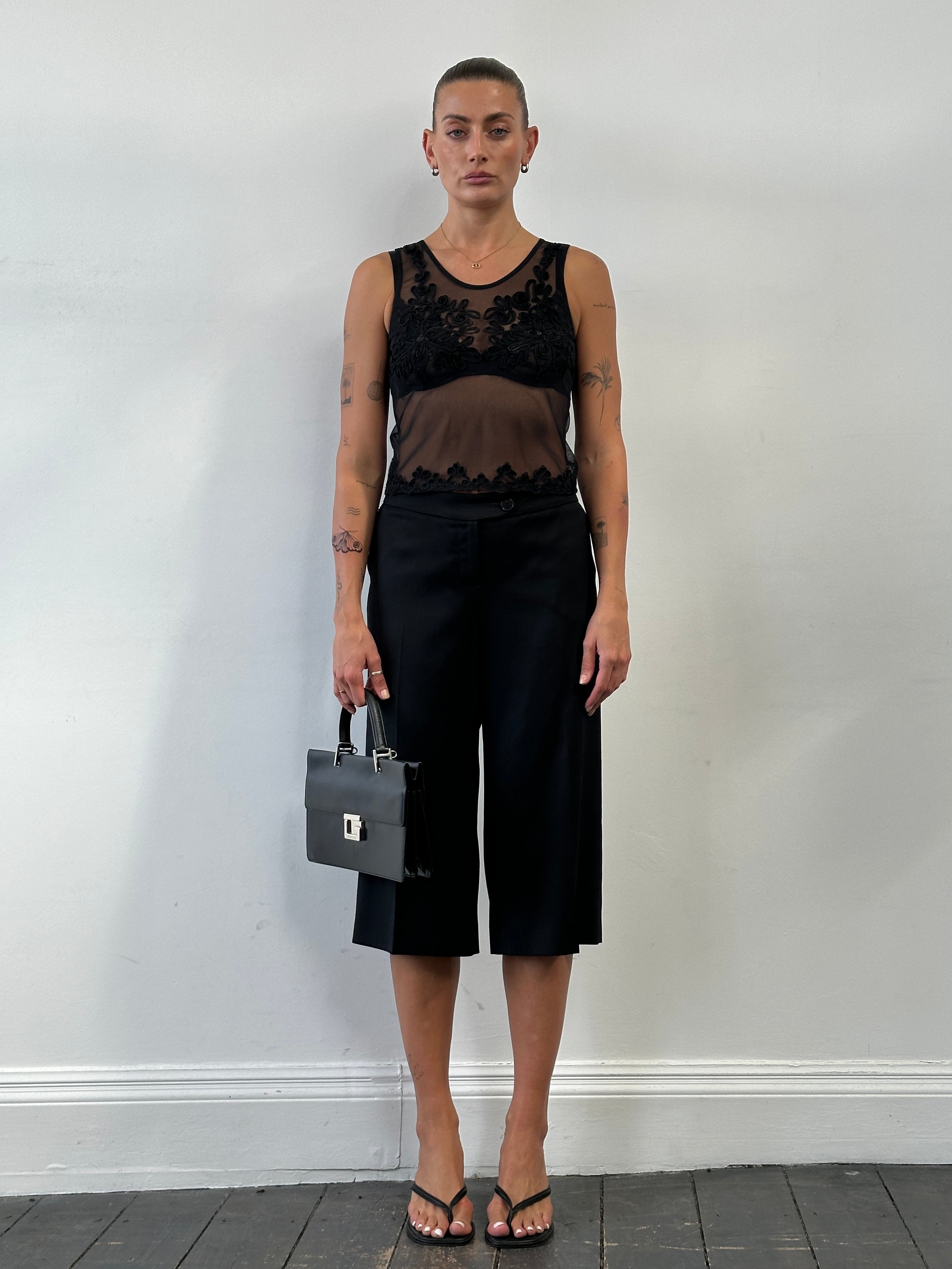 Jaeger pure wool low waist straight leg culottes shorts in beige fabric, W34 size, displayed on a hanger.