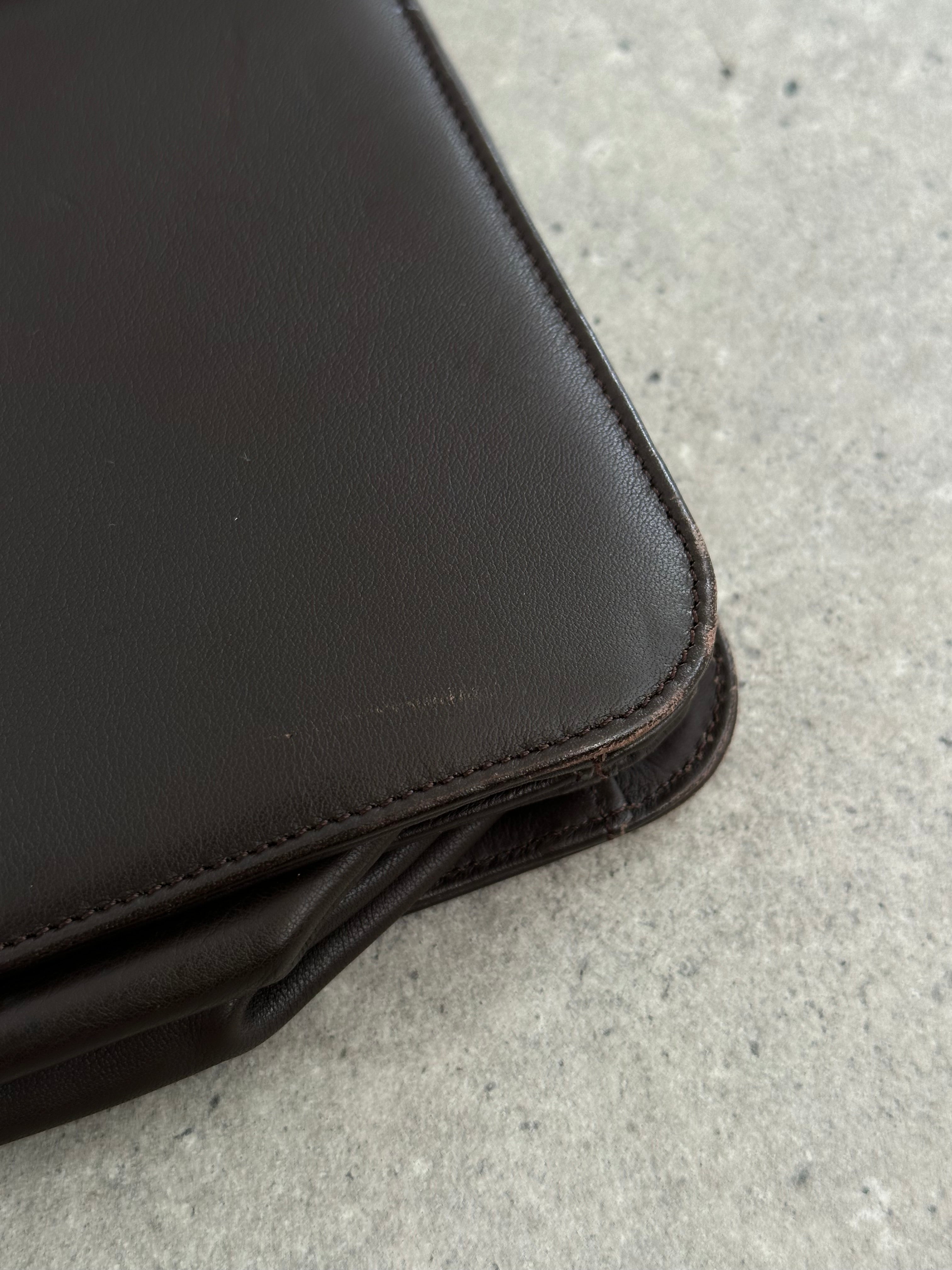 Giorgio Armani Le Collezioni leather shoulder bag in black with sleek design and subtle embossed logo.
