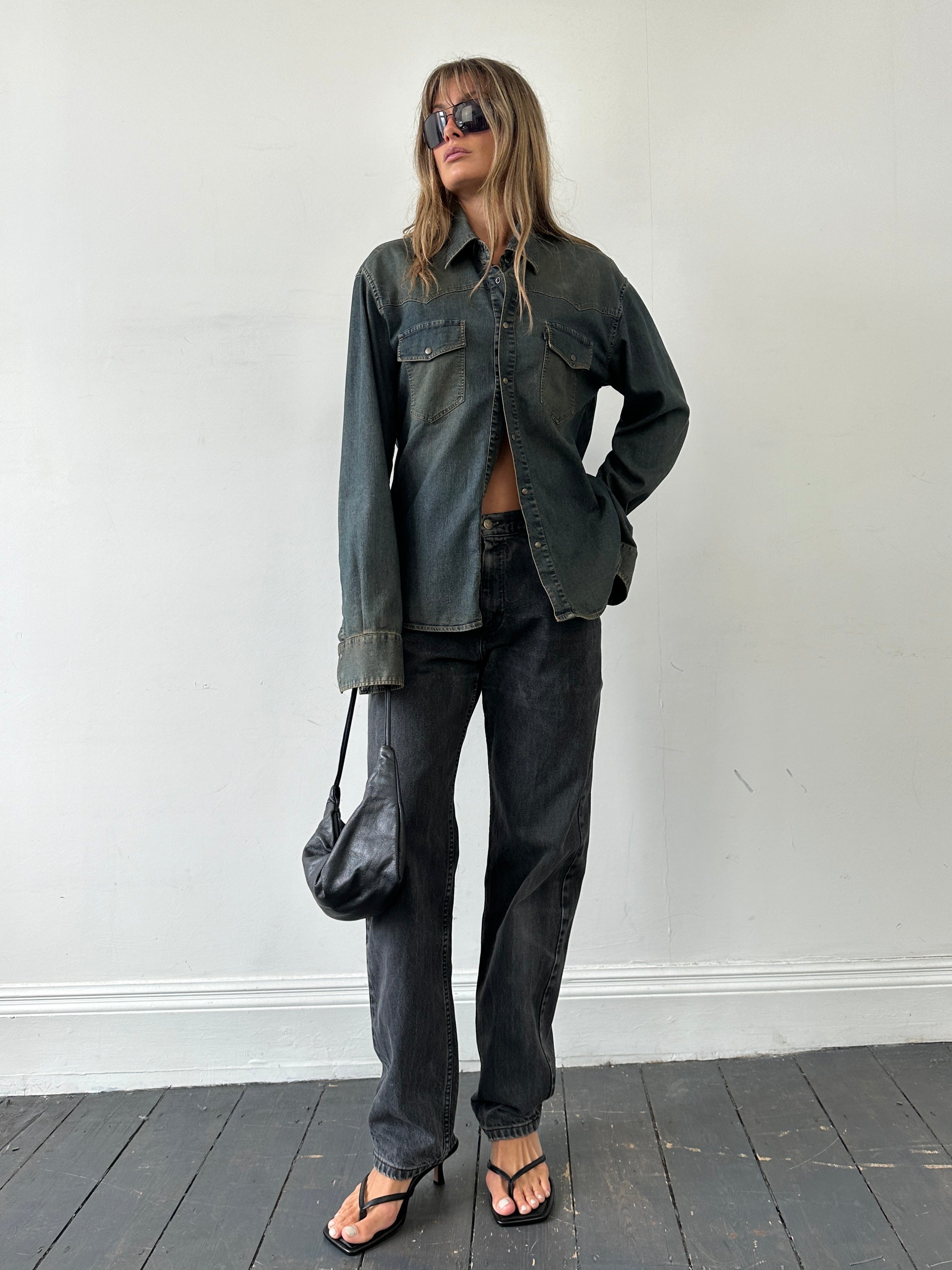 Lee high waisted straight leg denim jeans in W32 laid flat, showing classic blue denim with front and back pockets.