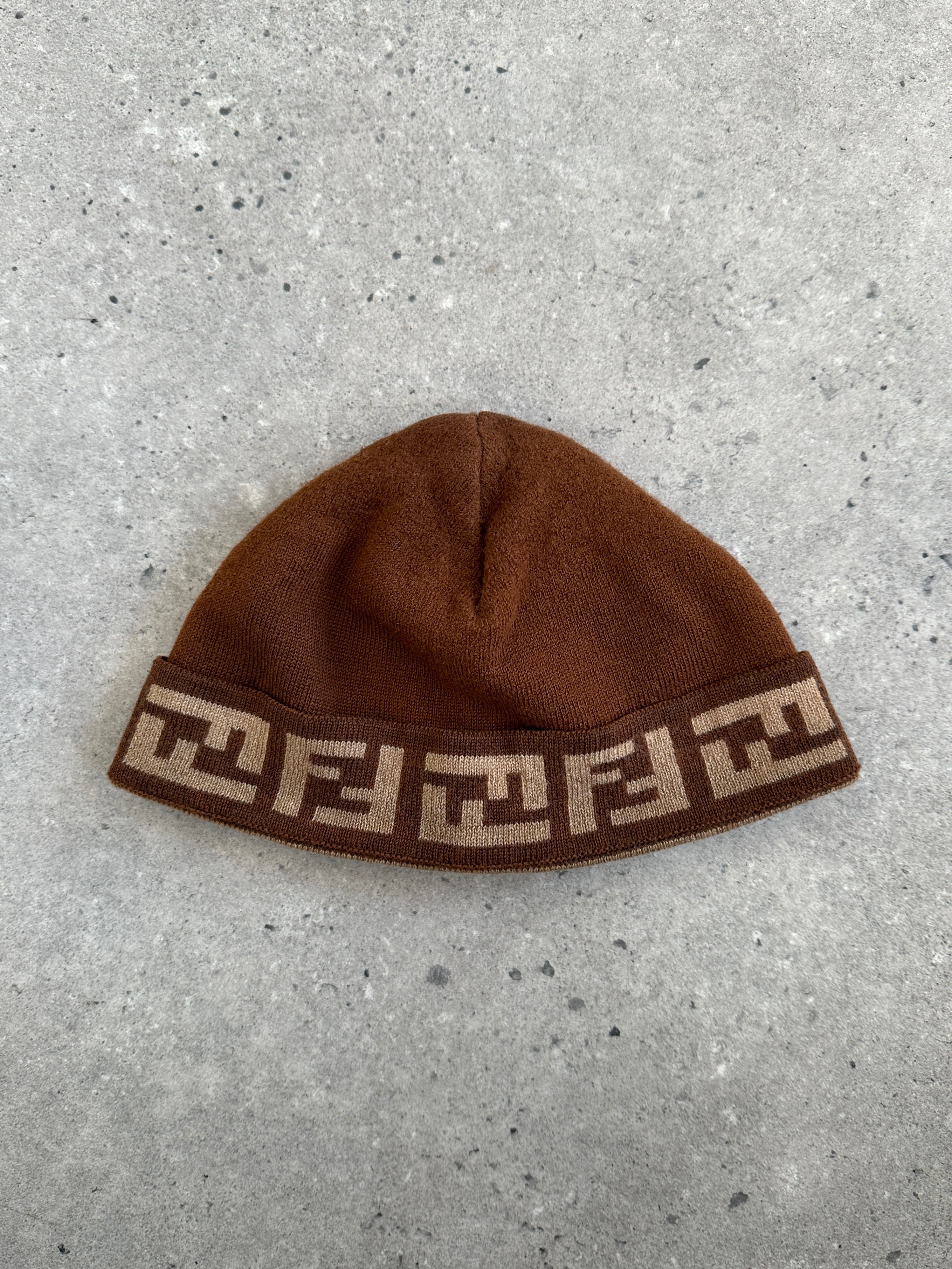 Fendi FF monogram print beanie hat in black and beige, stylish knitted accessory with iconic logo pattern.
