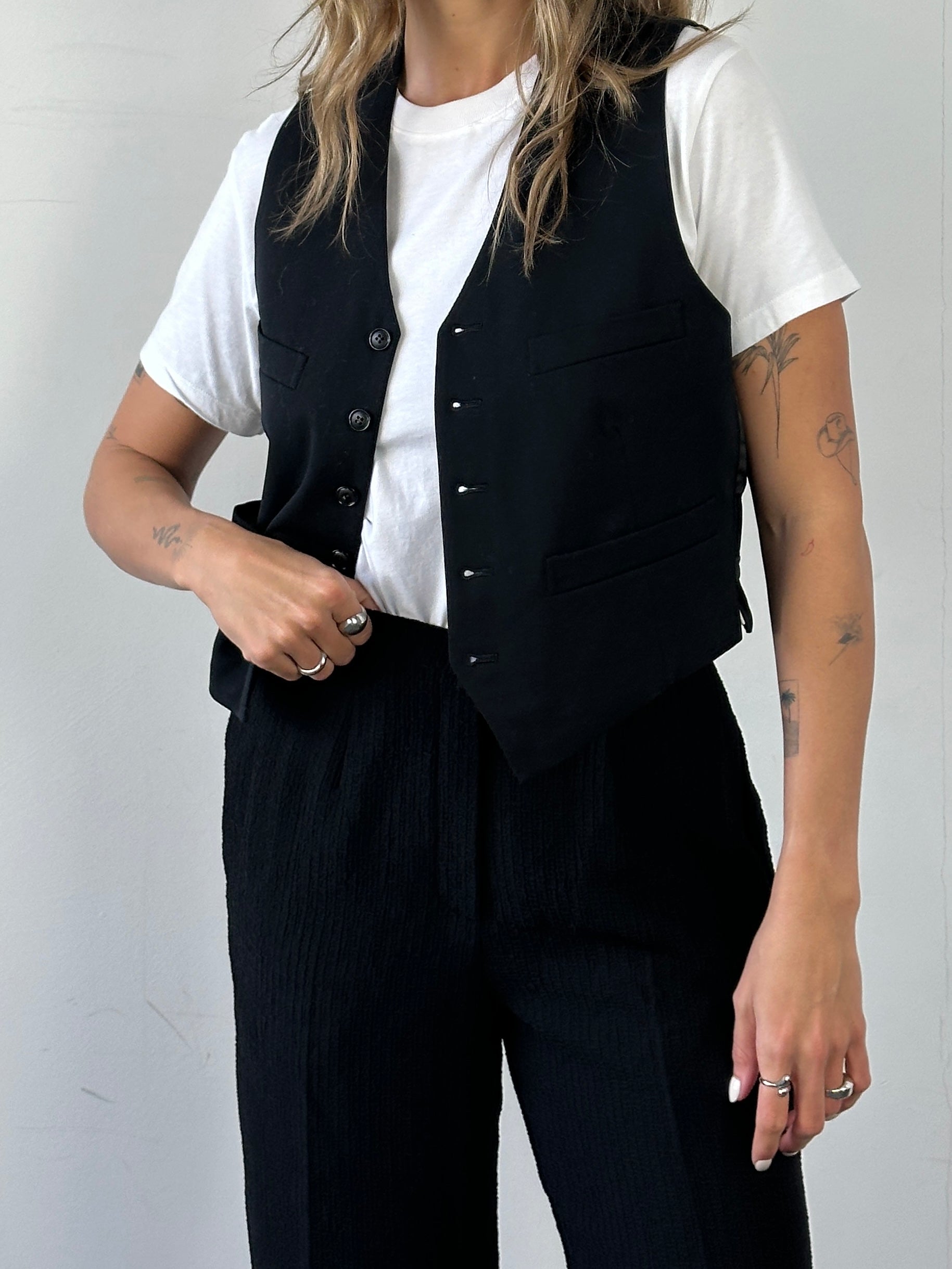 Vintage high waisted textured trousers in size W26, featuring a classic fit and detailed fabric texture.
