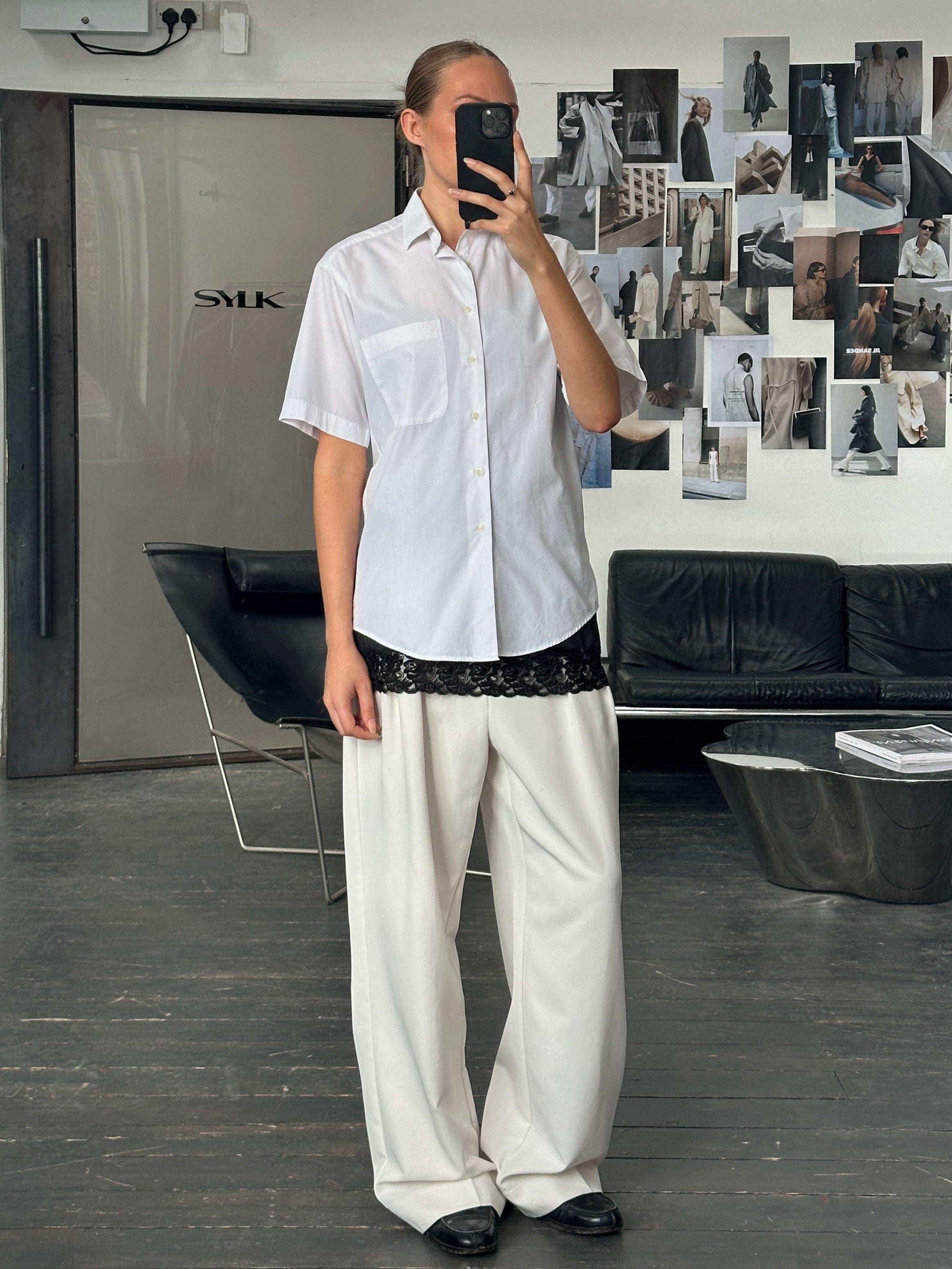 Yves Saint Laurent 1980s logo cotton short sleeve shirt in black and white, featuring classic YSL branding and a vintage fit.