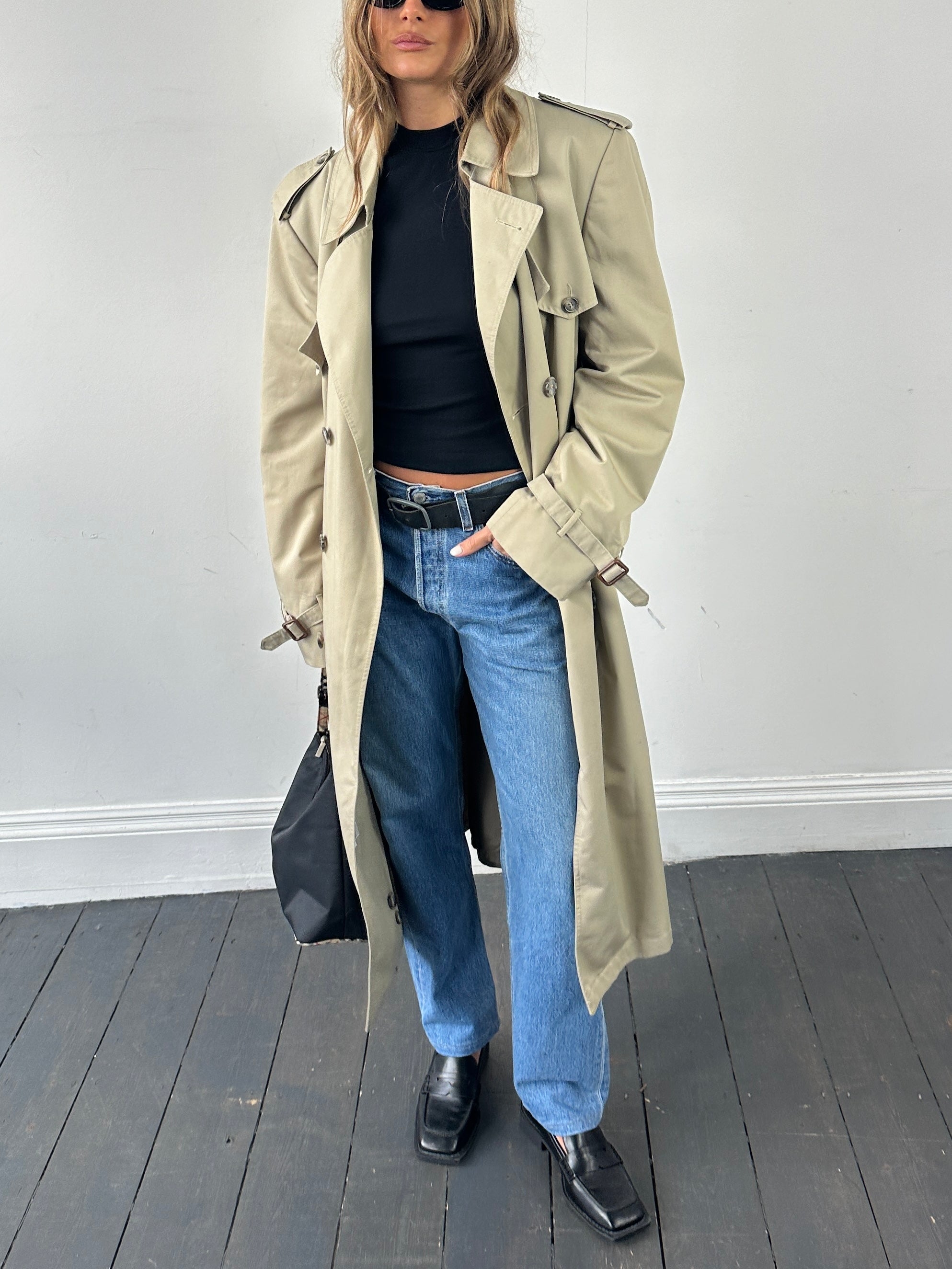 Christian Dior double-breasted belted trench coat in XL, beige color, stylish long coat with wide lapels and belted waist.