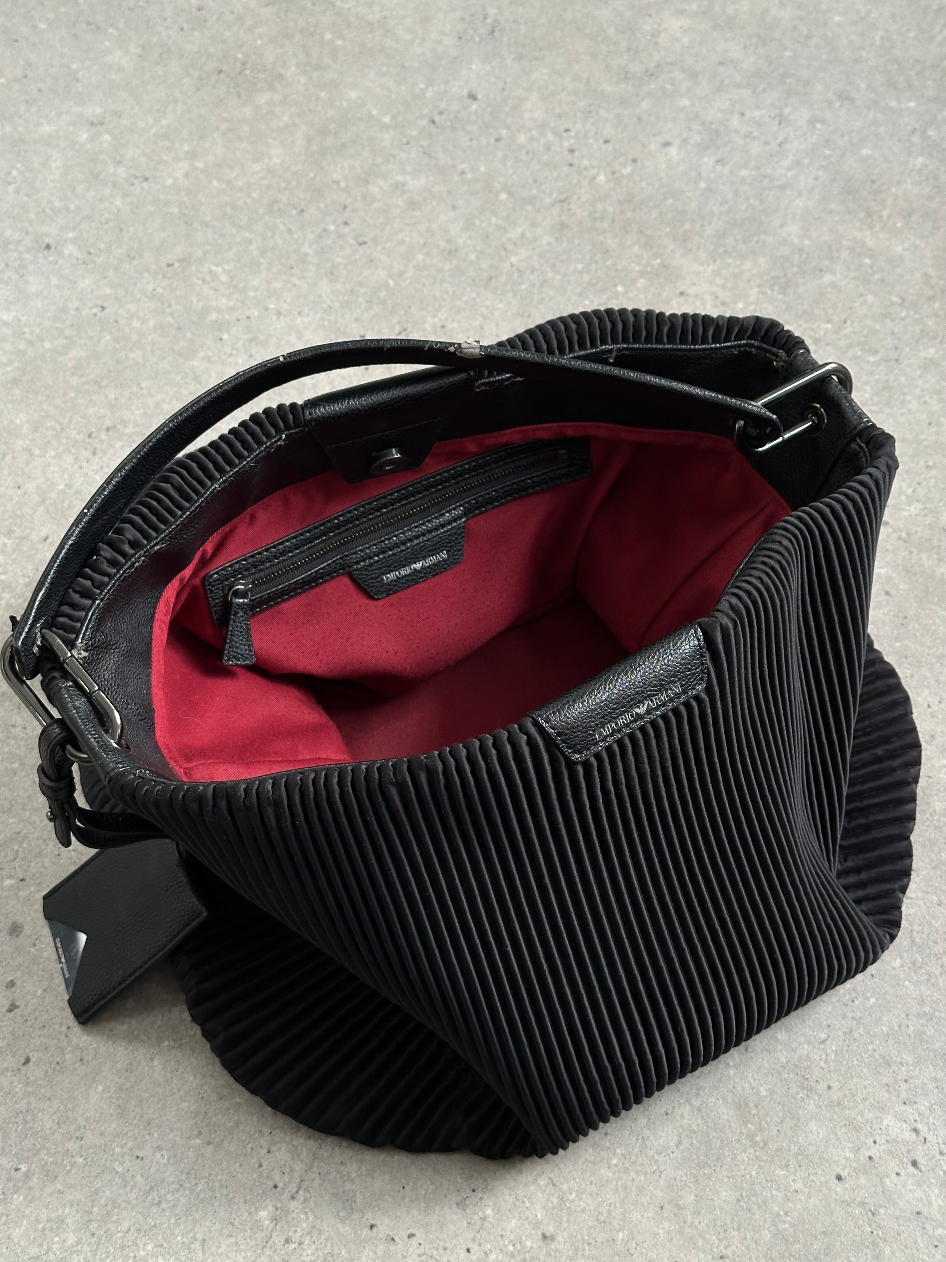 Emporio Armani pleated shoulder bag with sleek design, featuring a structured shape and stylish detailing.