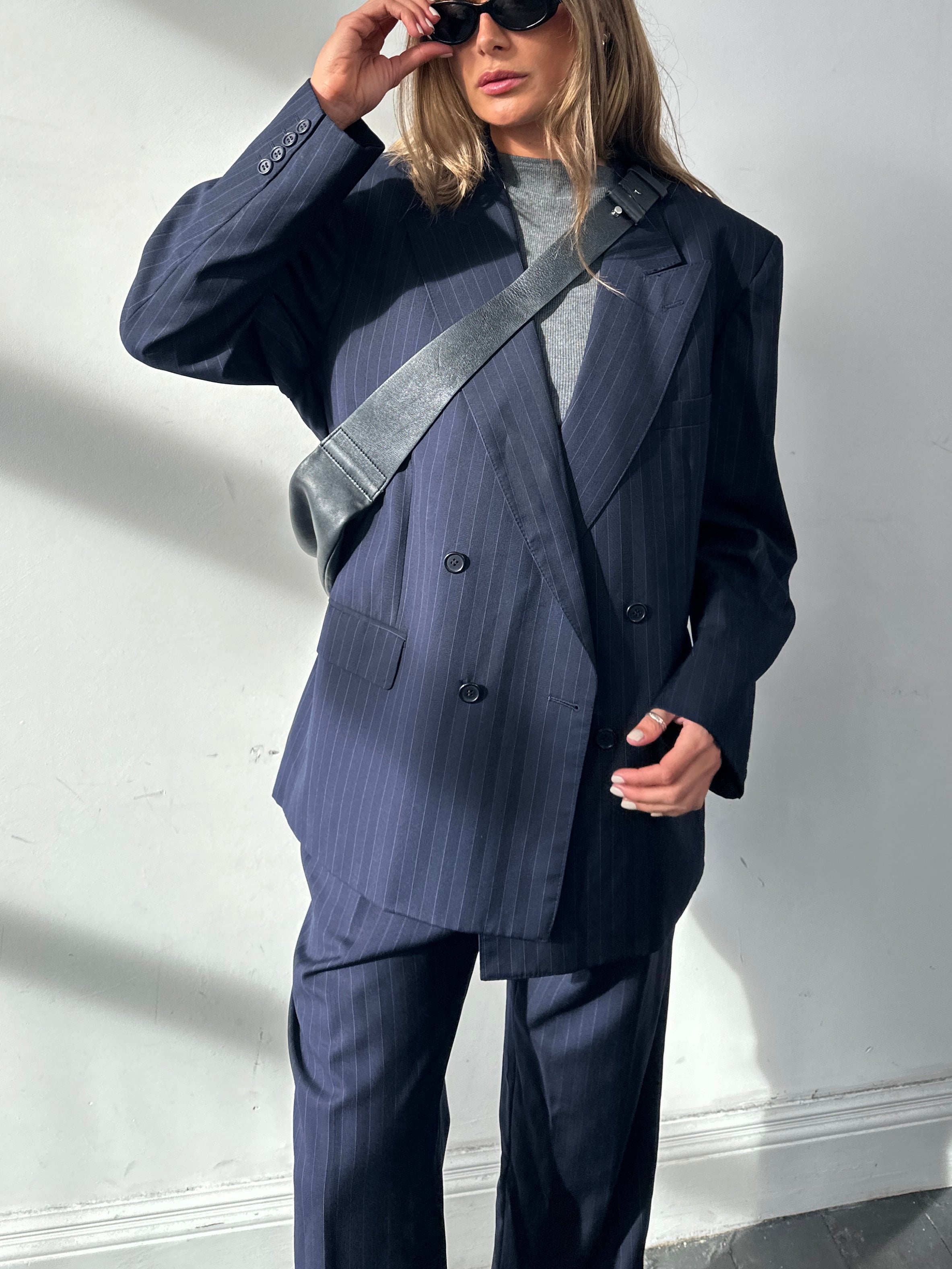 Christian Dior Monsieur pinstripe wool double-breasted suit in size 44S/W34, featuring tailored lapels and classic design.