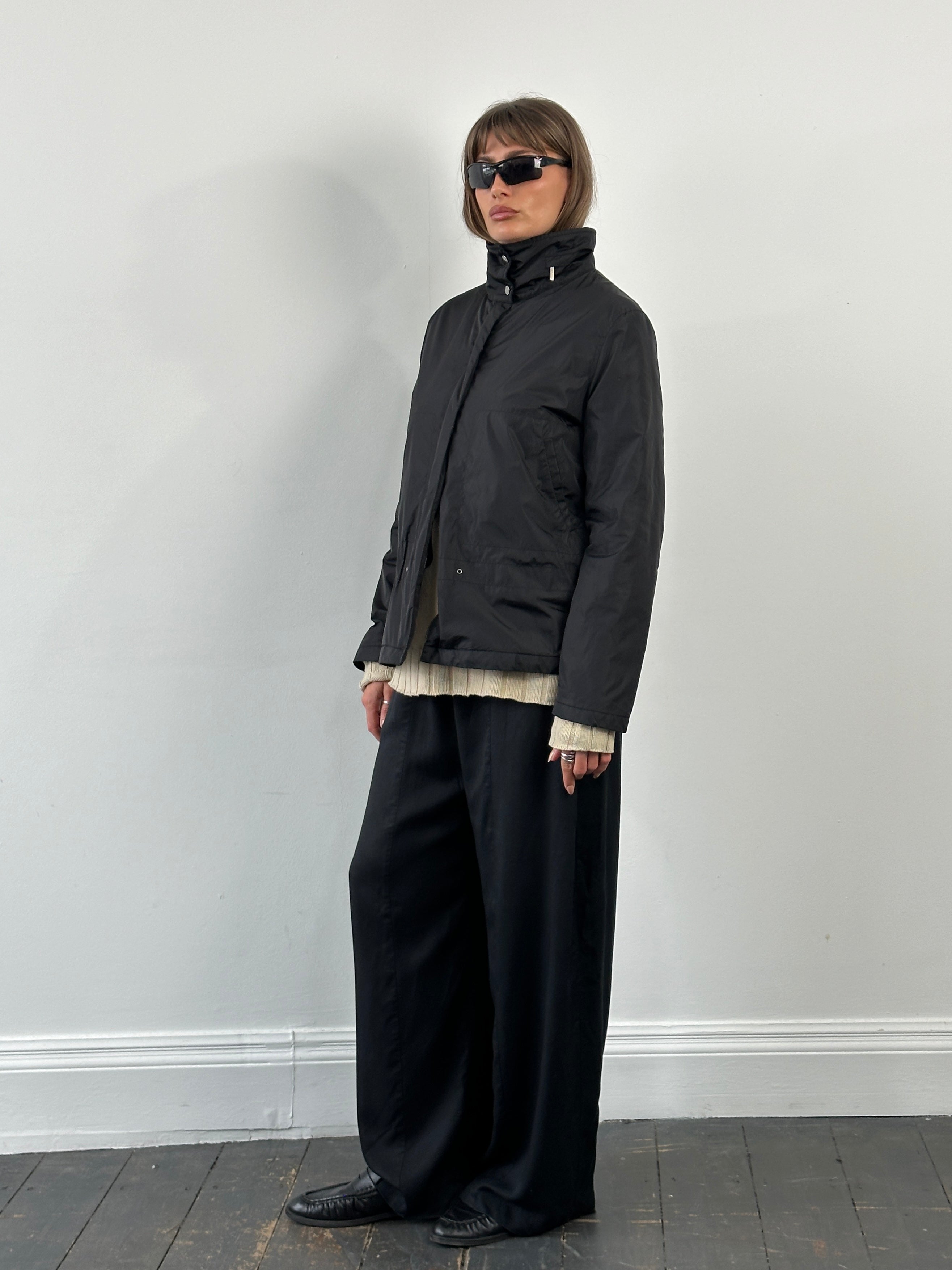 Burberry London 2000s nylon high-neck jacket in black, featuring a high collar and sleek design, size large.