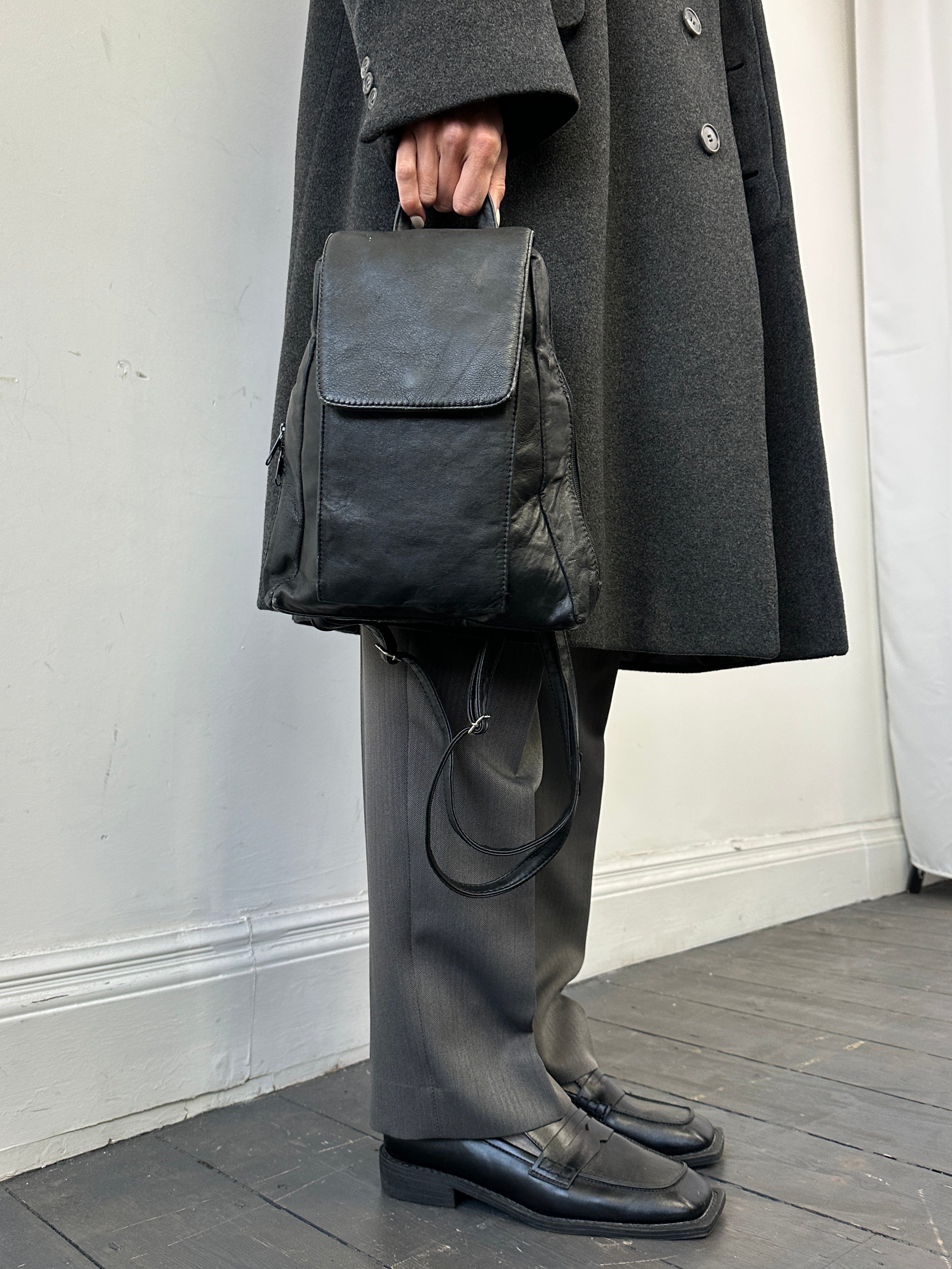 Vintage Faux Leather Rucksack bag with adjustable straps and front pocket, stylish and durable for everyday use.