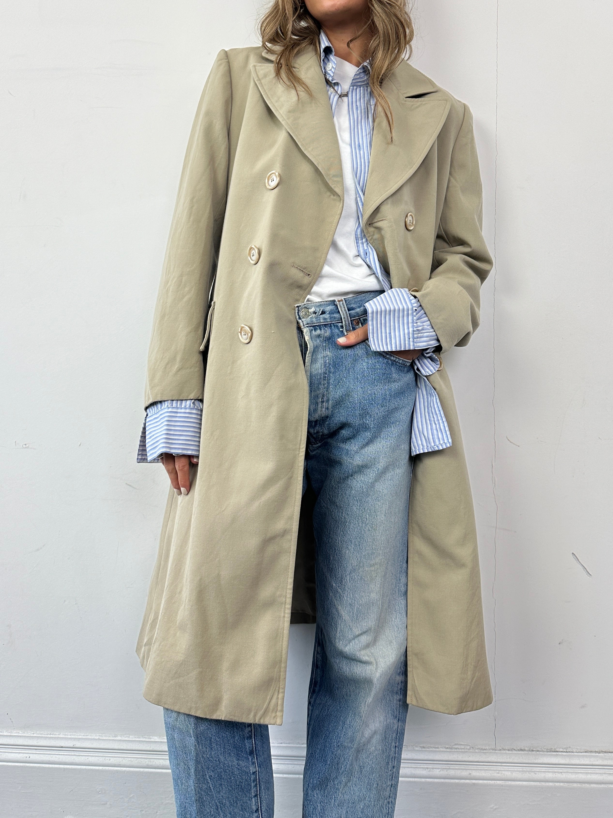 Vintage Italian double-breasted wool trench coat in classic style, shown in natural beige with collar and button details.