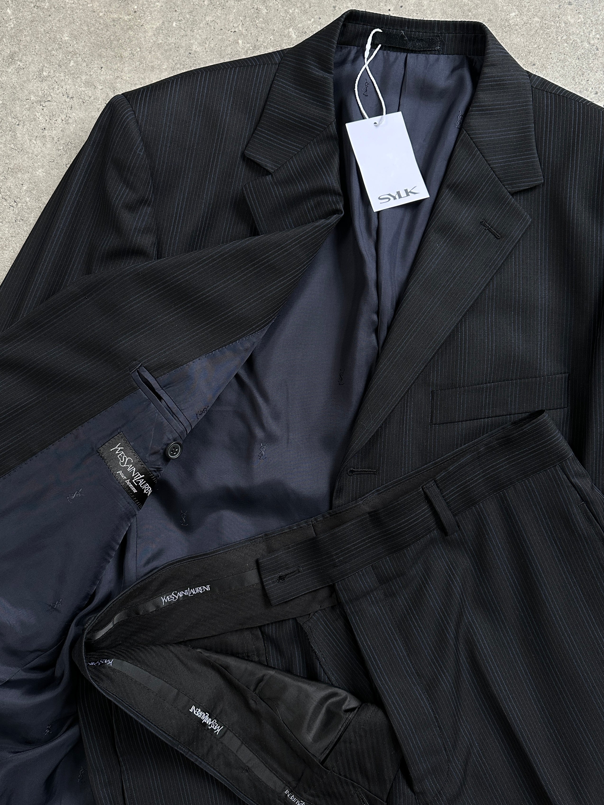 Yves Saint Laurent pinstripe wool jumpsuit, single-breasted suit in size 40S/W32, tailored fit with classic lapel design.