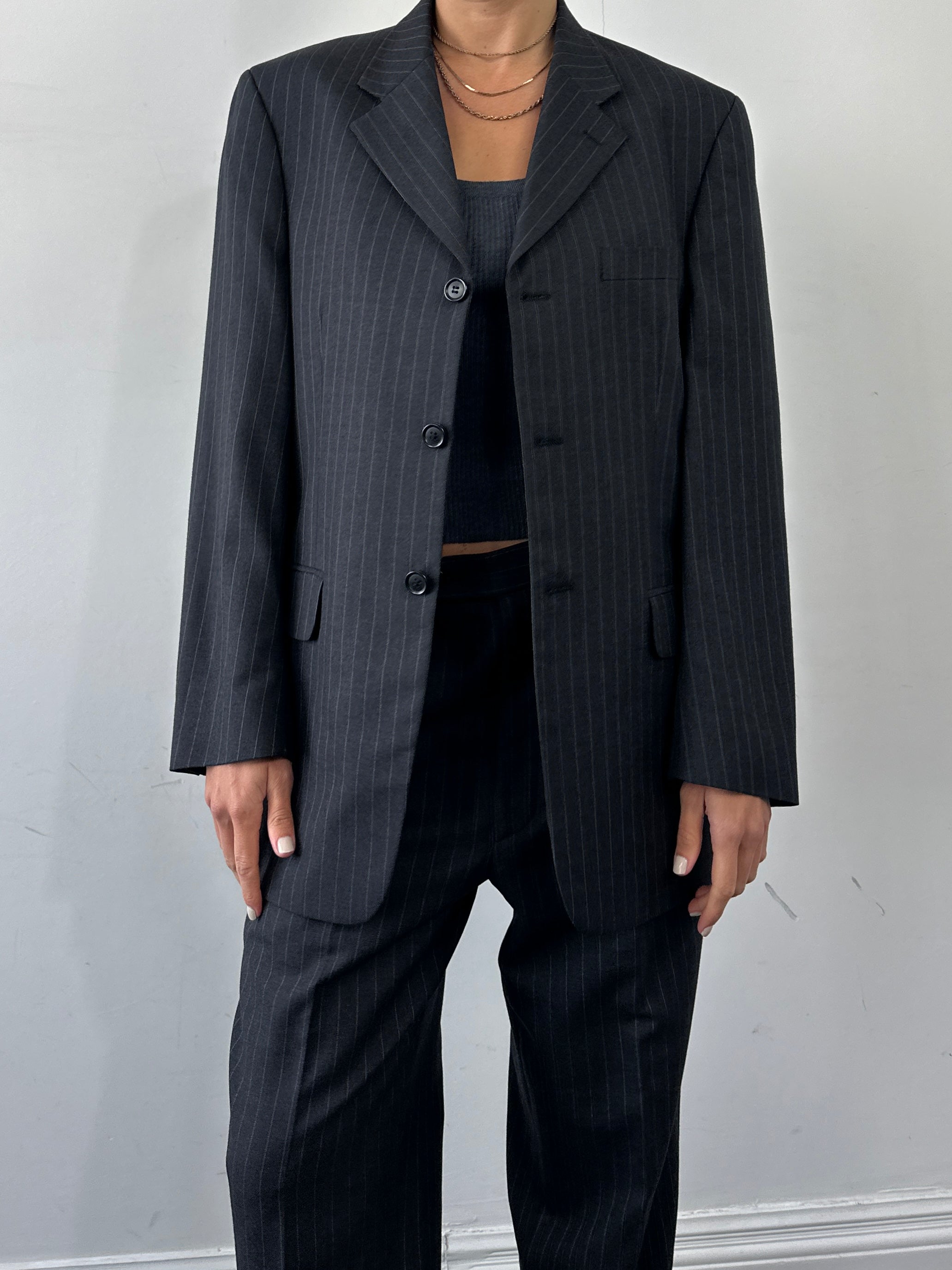Pierre Cardin pinstripe pure wool single-breasted jumpsuit in size 40R/W32, tailored fit with lapel collar and front buttons.