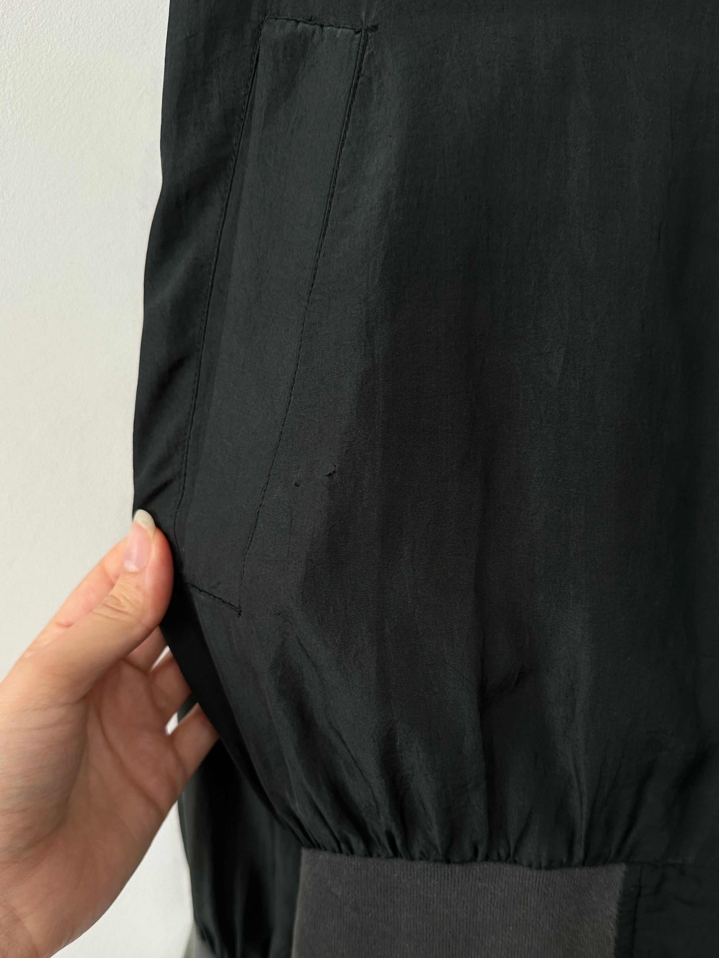 Vintage pure silk bomber jacket in size L, featuring a classic design with a smooth, shiny silk finish and ribbed cuffs.