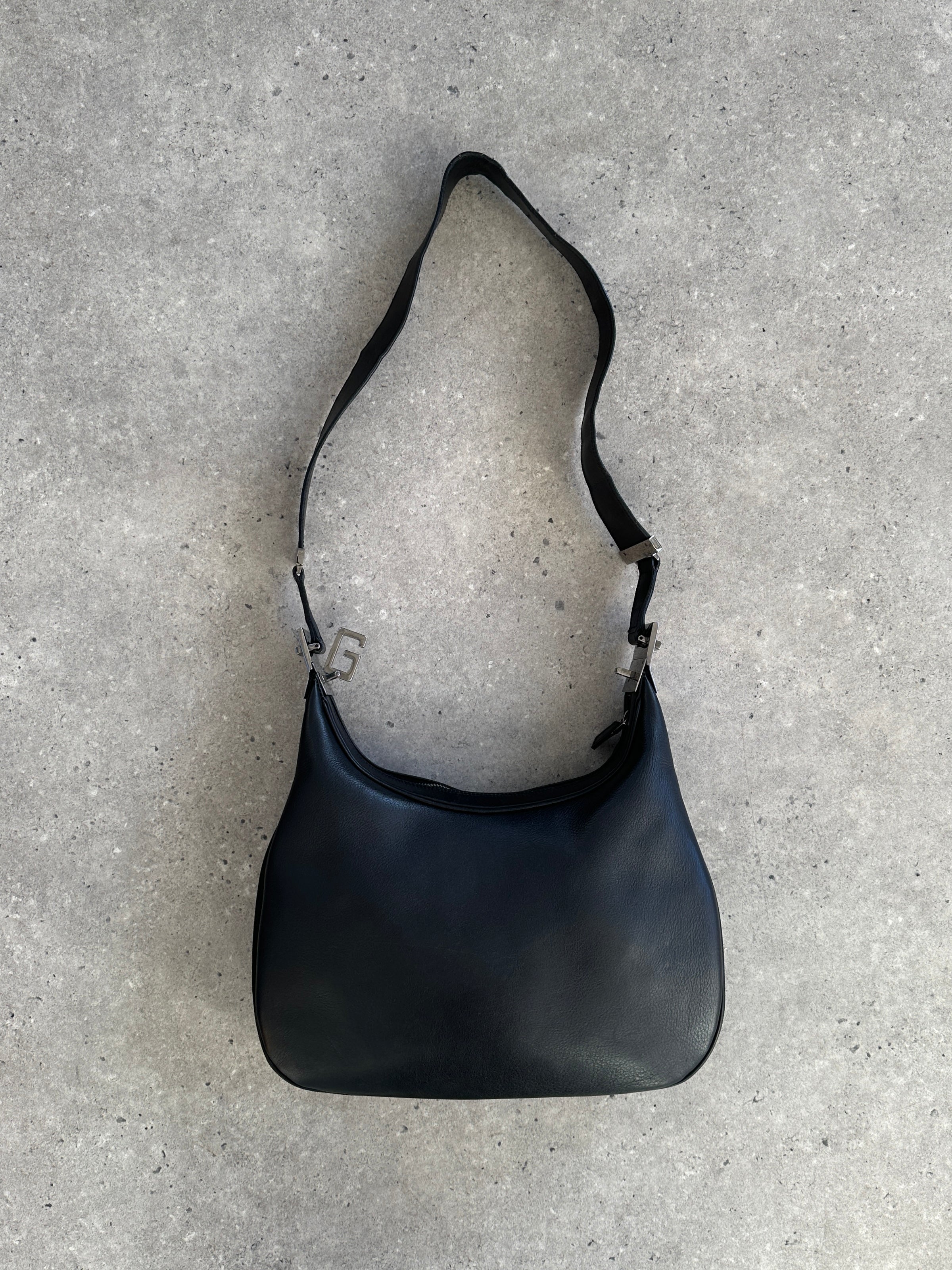 Gucci 1990s Tom Ford GG leather 3-in-1 attaché bag with handles and compartments, showcasing classic luxury design.