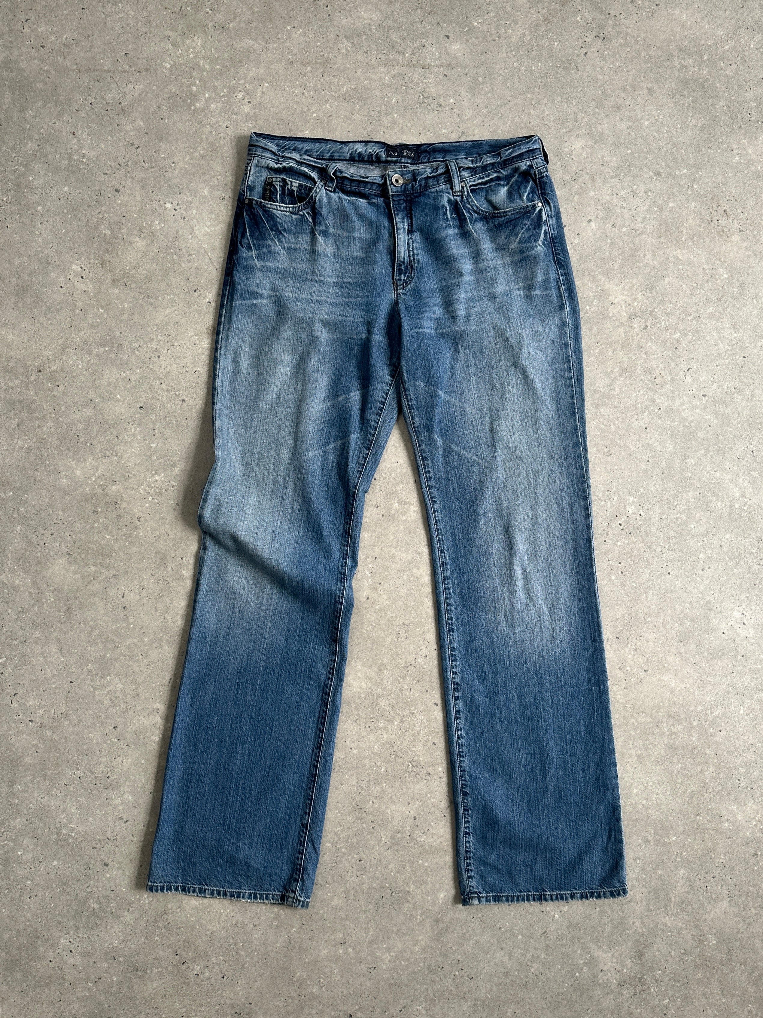 Armani Jeans stonewashed mid-rise denim jeans in size W34, showcasing classic fit and light blue fabric with subtle fading.