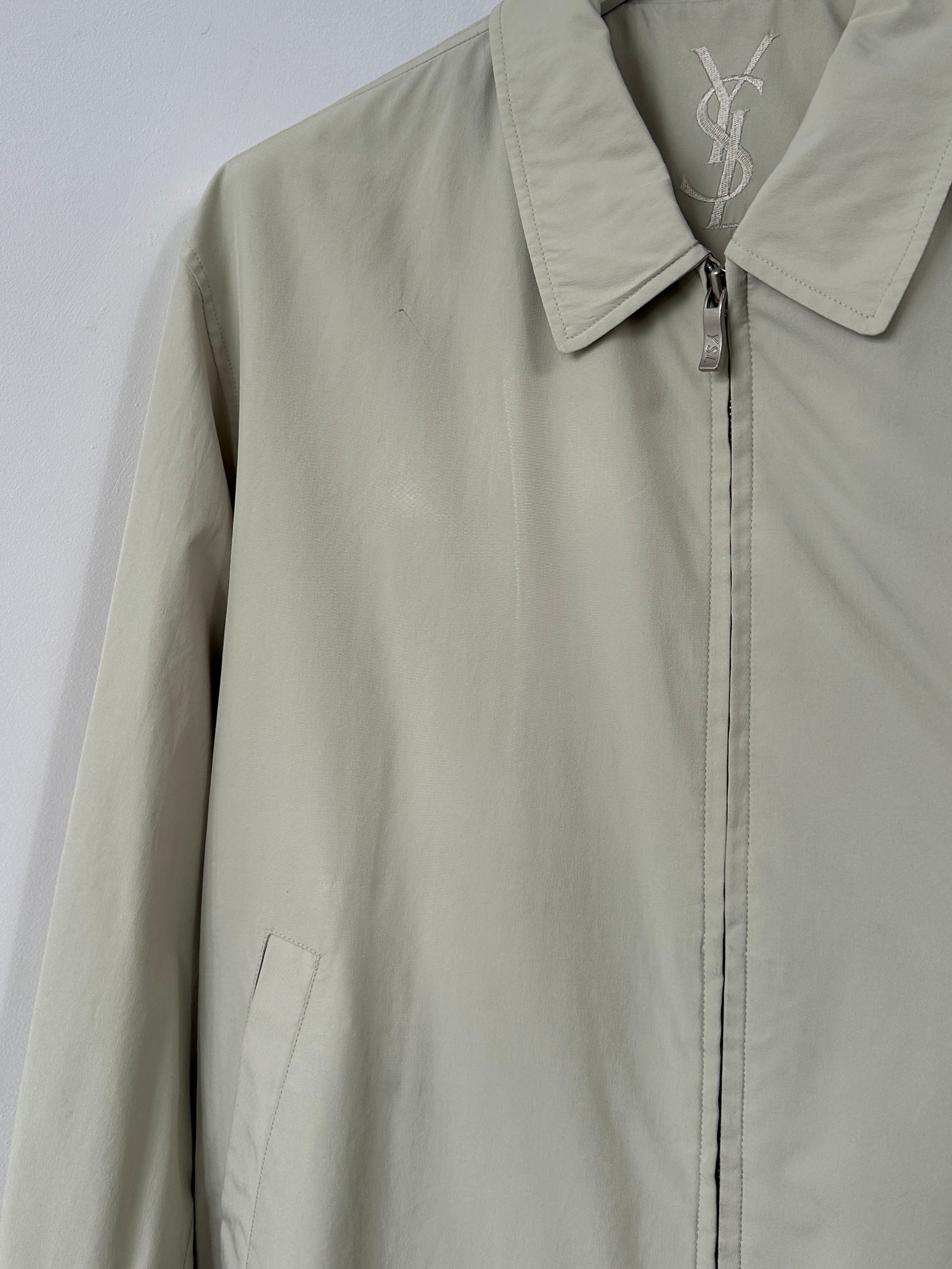 Yves Saint Laurent Pour Homme logo bomber jacket in black, front view showing logo details and classic bomber style.