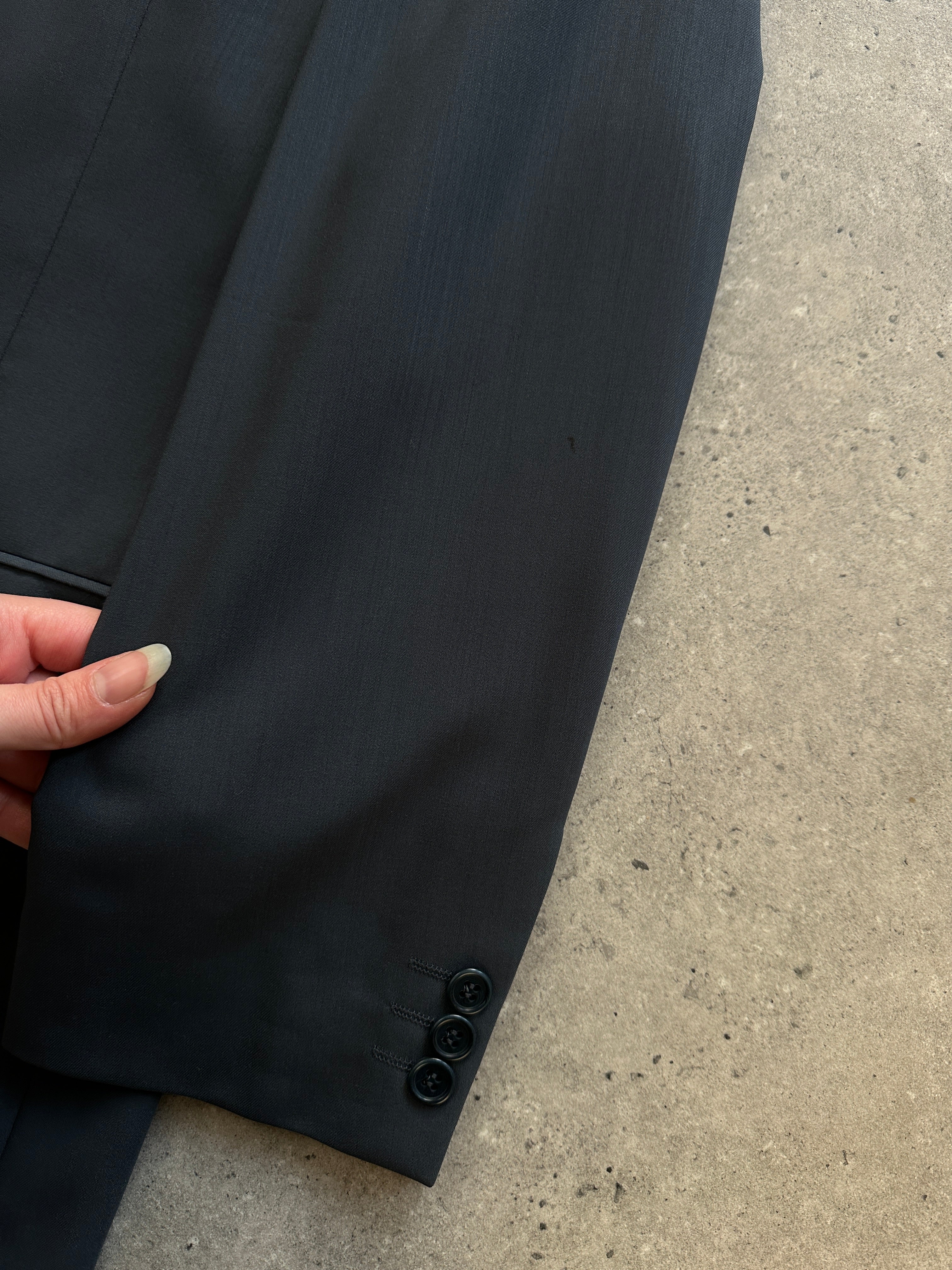 Balmain pure wool single-breasted jumpsuit in size 38S/W32, featuring a tailored fit and classic design.