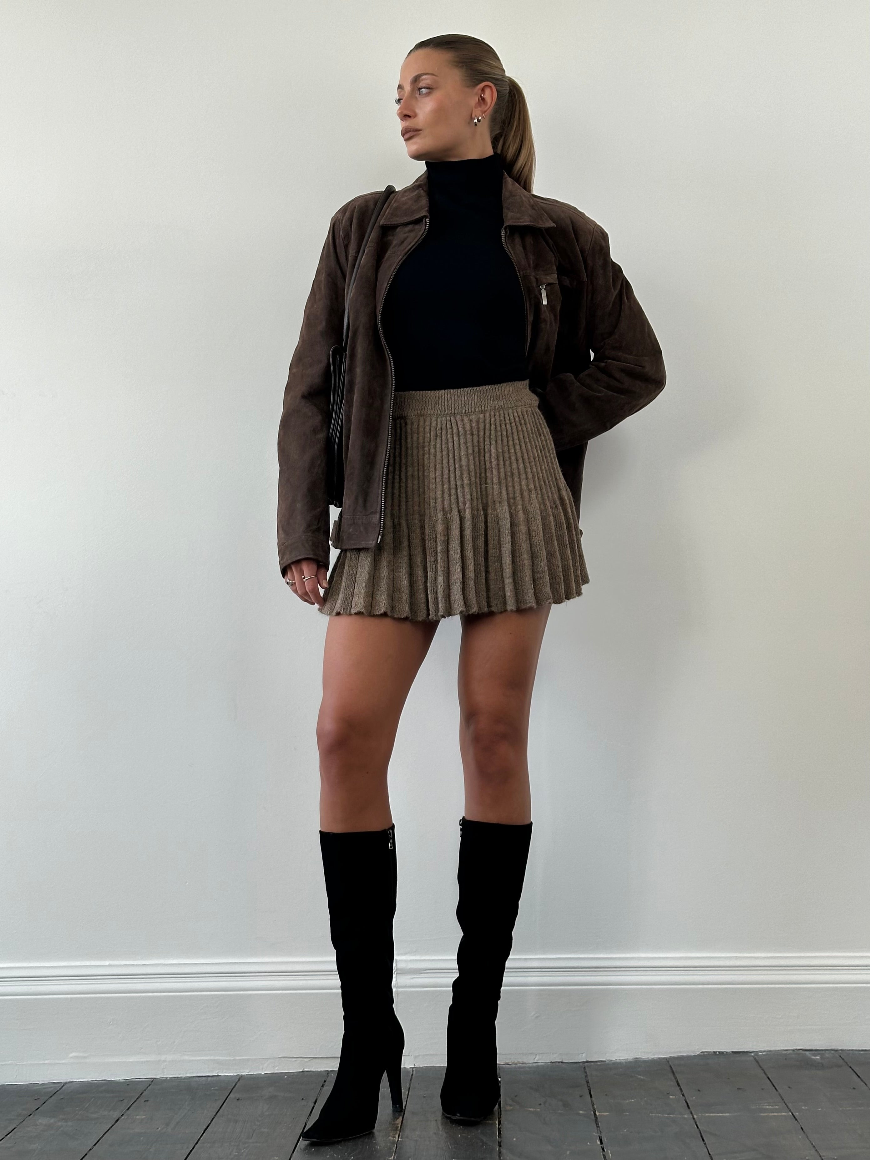 Vintage Italian mohair blend pleated skirt in S/M with a classic design, showcasing soft fabric and elegant pleats.