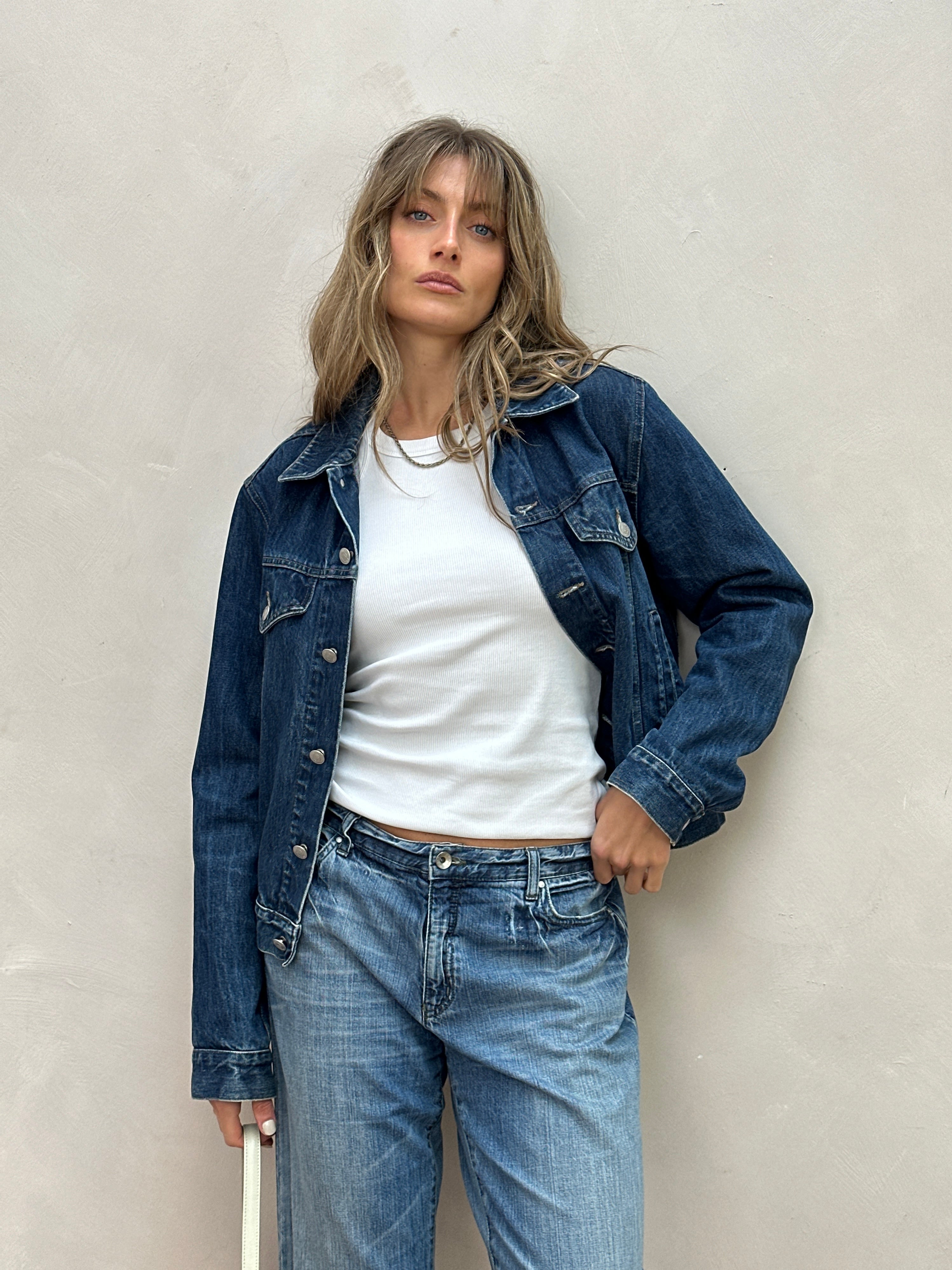 Armani Jeans mid wash denim jacket in size S/M, featuring classic collar, button front, and stylish stitching details.