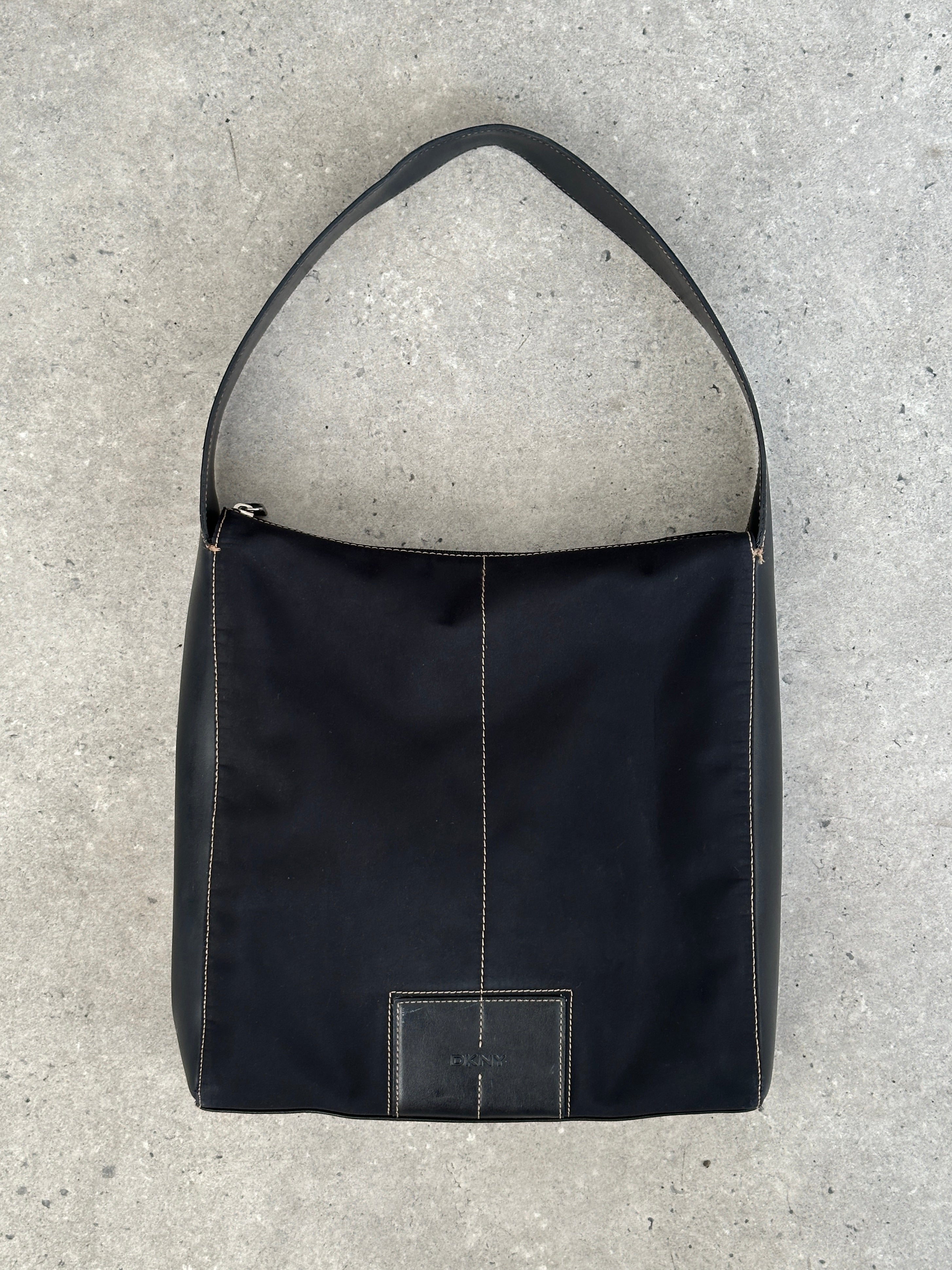 Donna Karan DKNY 2000s contrast stitch shoulder bag with sleek design, featuring a structured shape and stylish shoulder strap.
