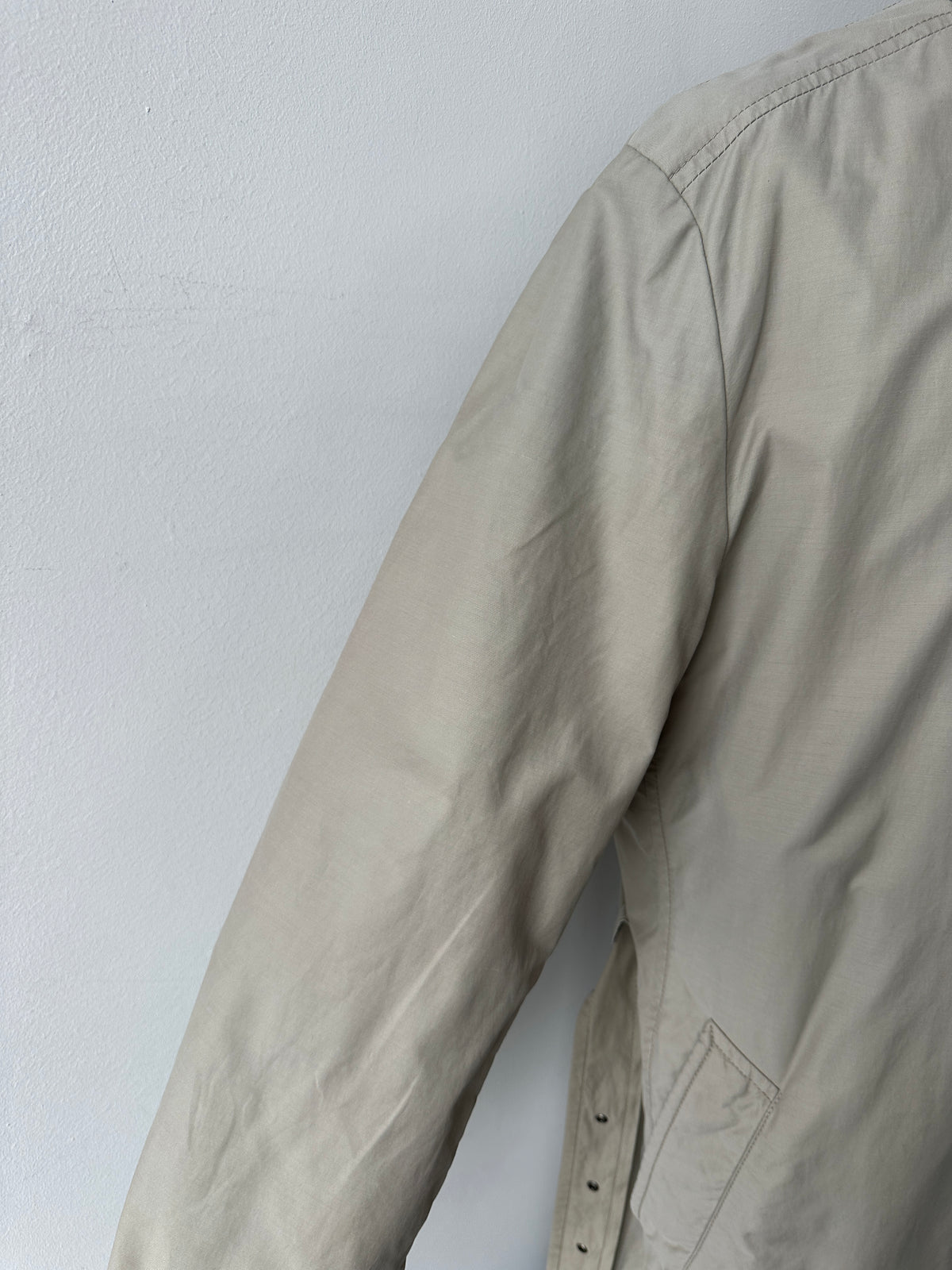 Hugo Boss 2000s high neck belted trench coat in beige, tailored fit, with belt and button details, shown on a model.