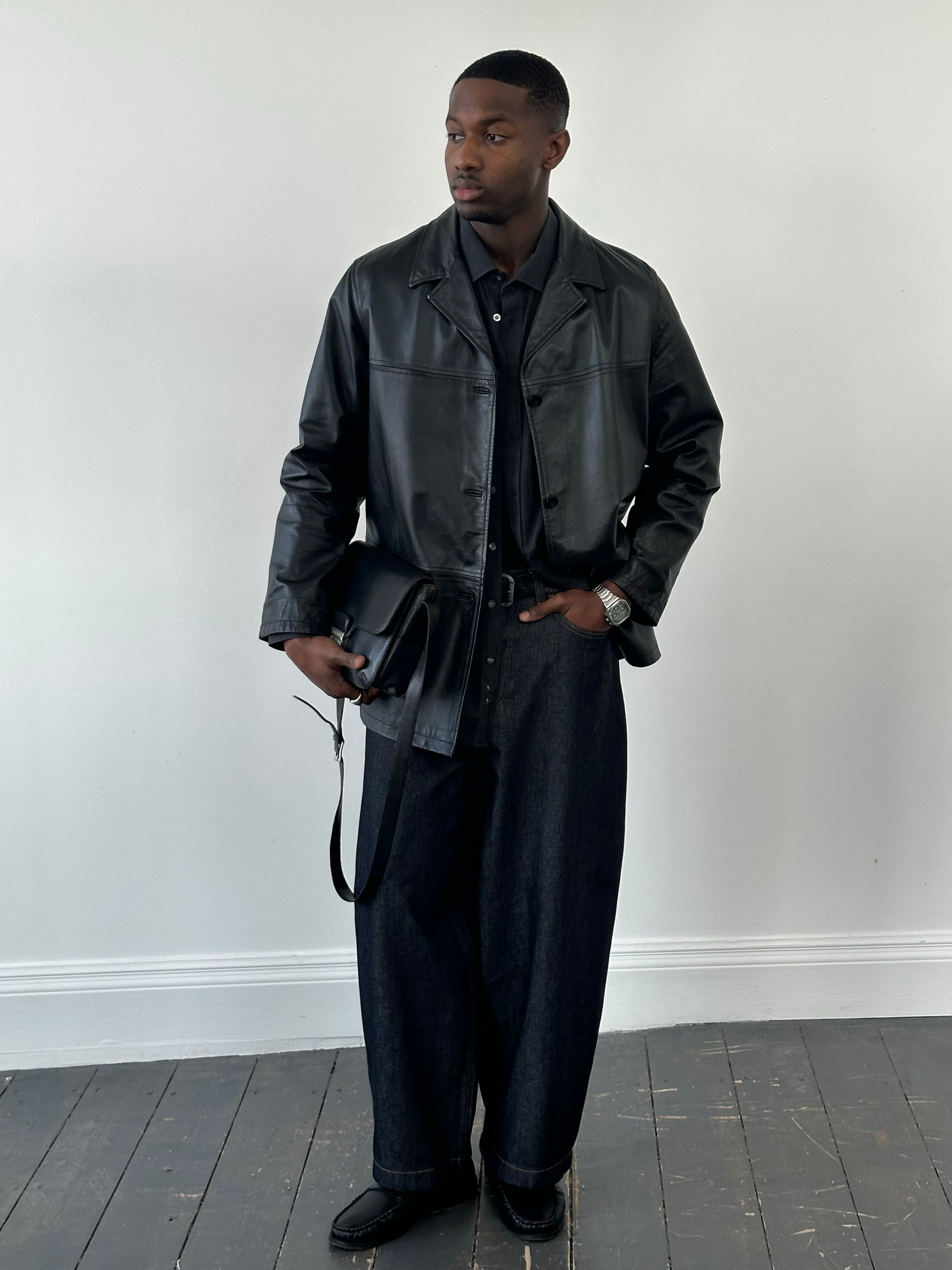 Italian vintage 1990s single-breasted leather jacket by Vintage, shown in classic brown leather with lapel collar and stylish design.