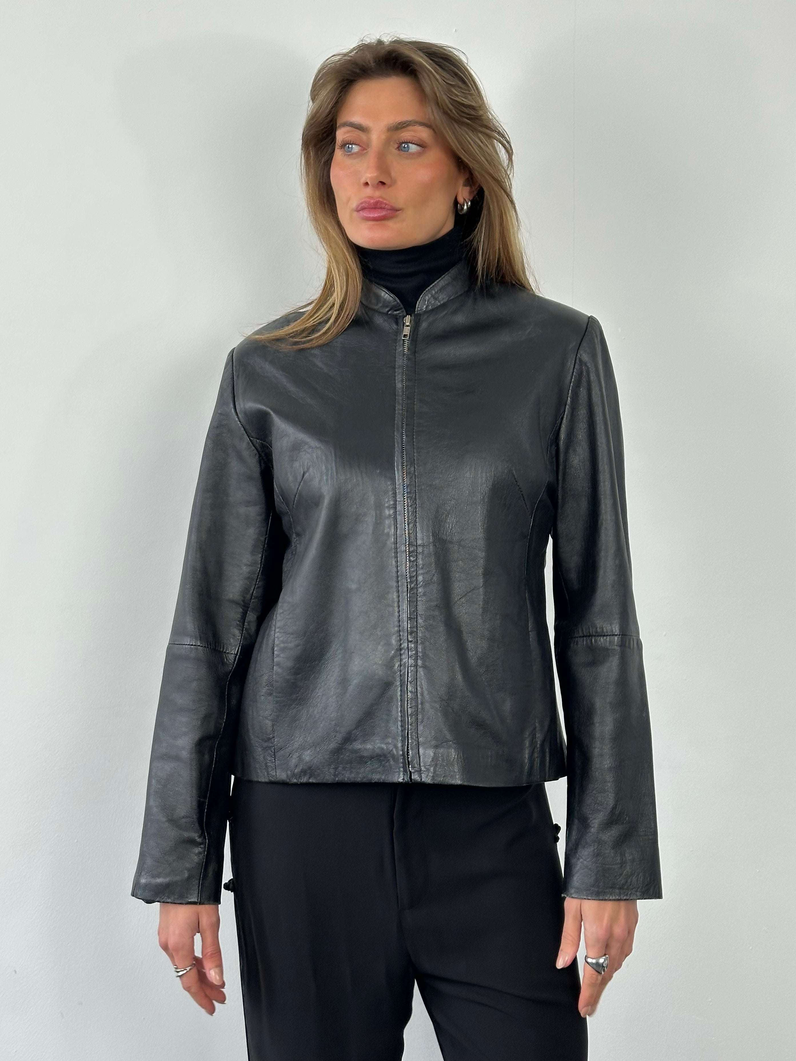 Vintage 1990s leather high neck jacket, size small, with classic collar and textured leather, vintage style, front view.