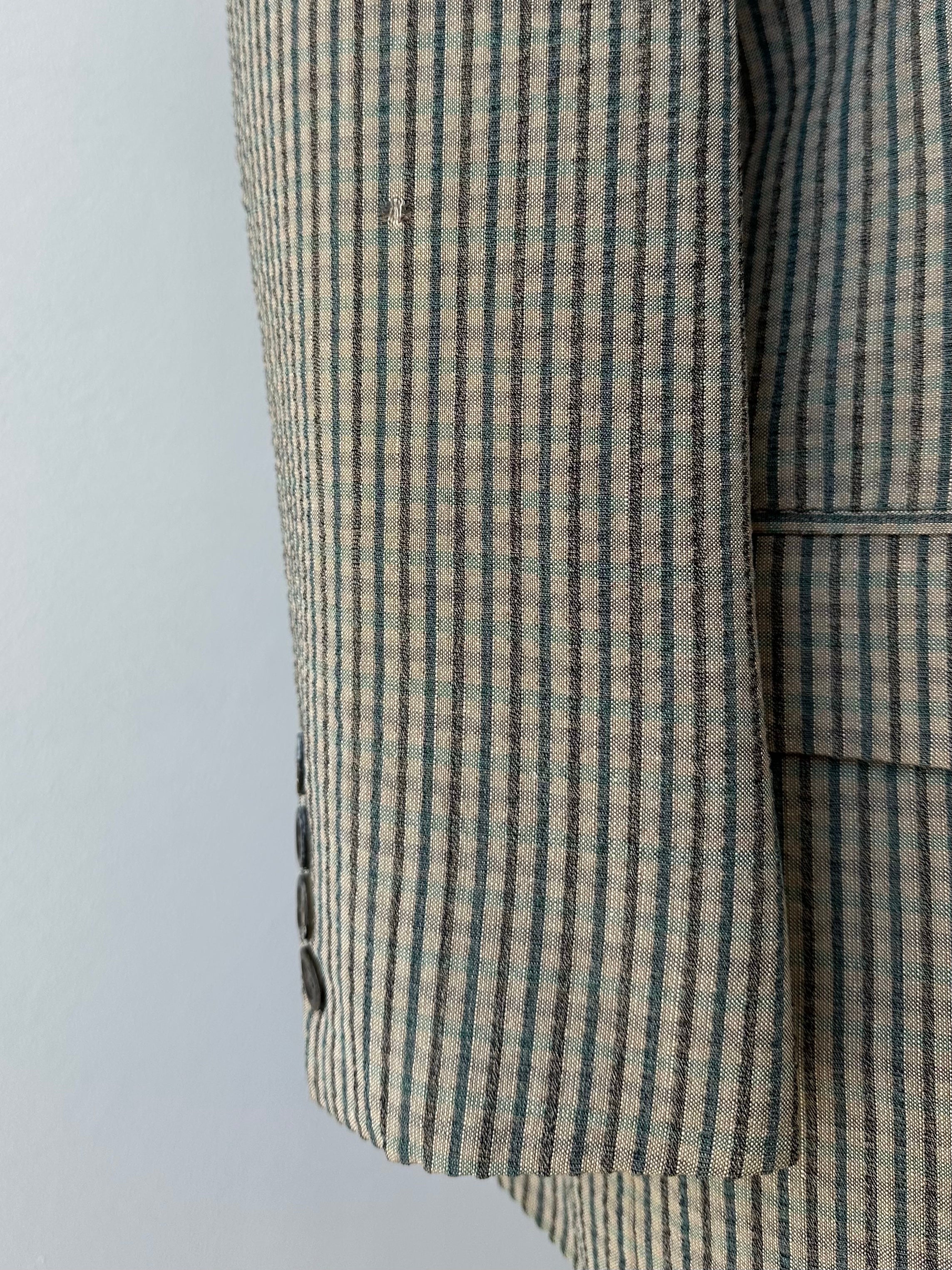 Burberry 1990s wool silk check unlined blazer, navy and beige pattern, tailored fit, with classic collar and button closure.