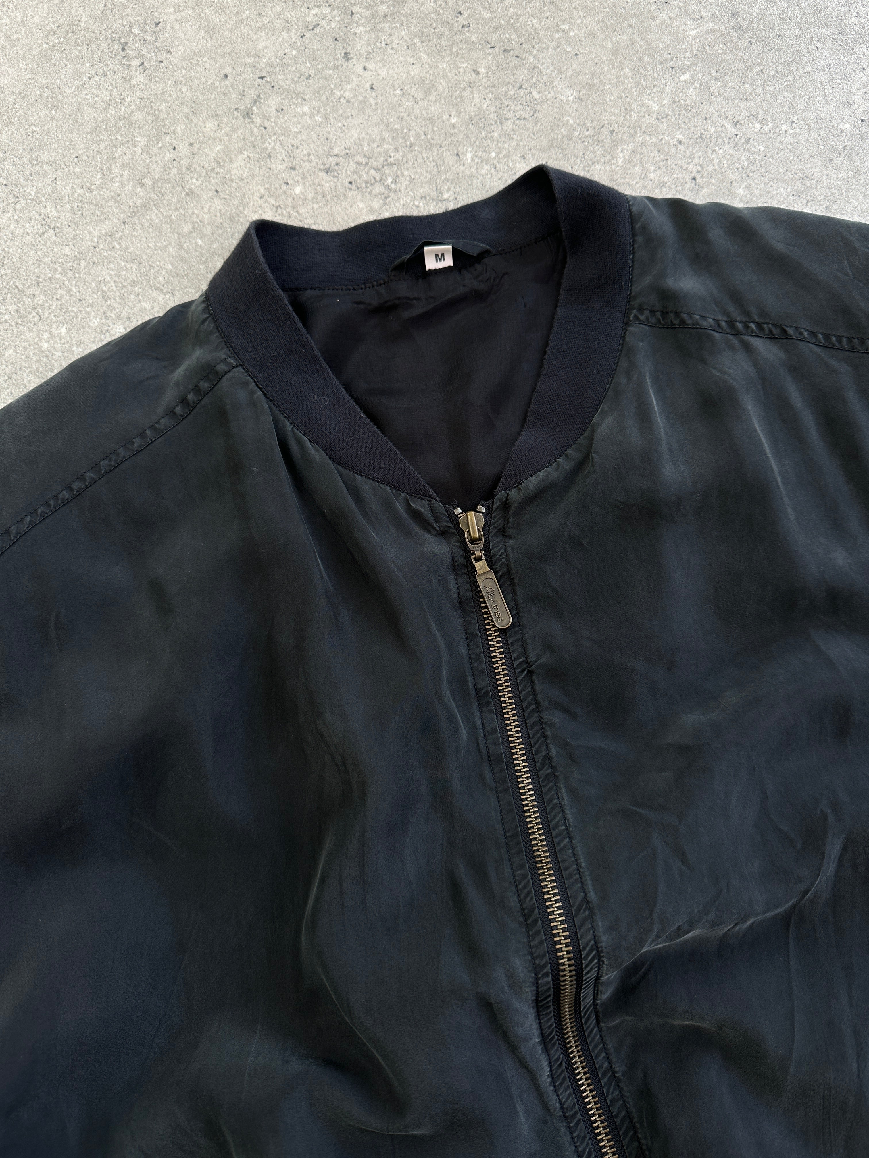 Vintage 1990s pure silk bomber jacket in size L, featuring a classic design with a smooth, shiny silk finish and ribbed collar.