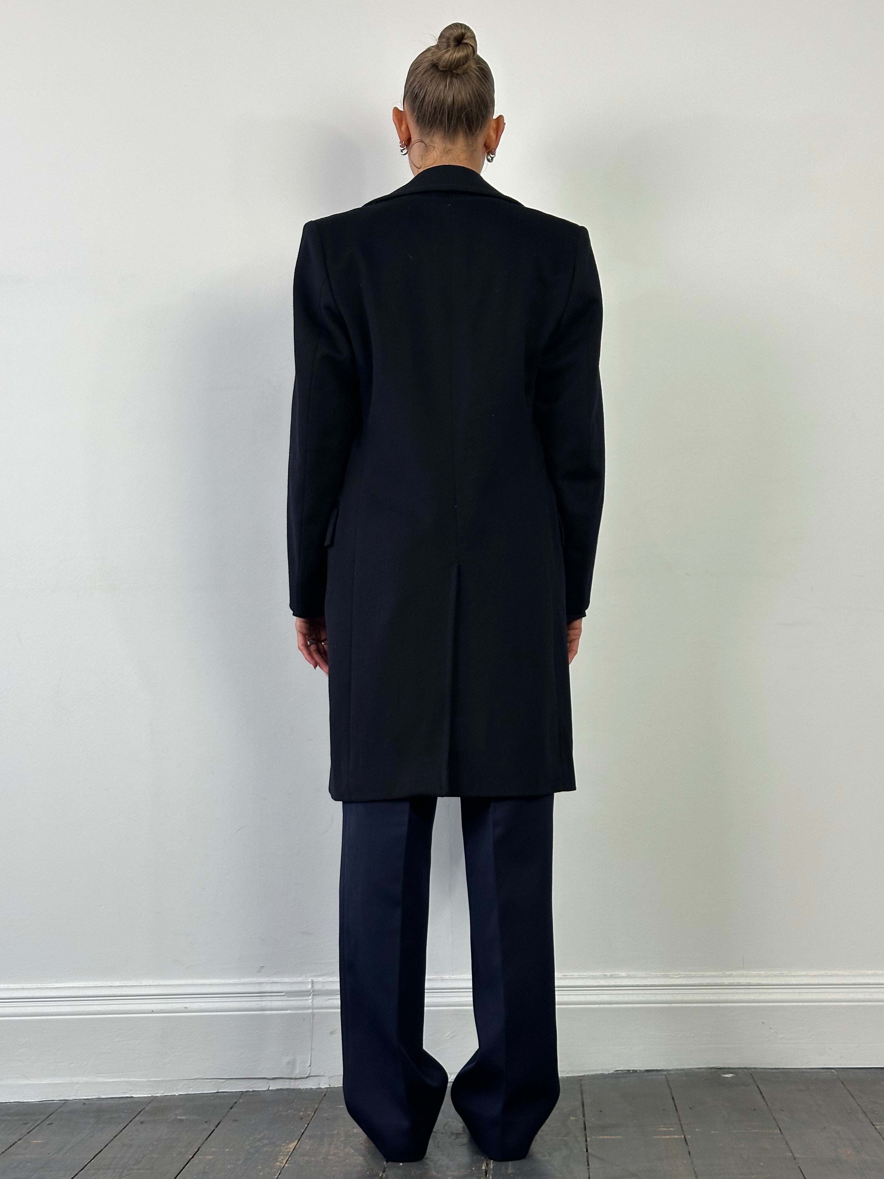 Vintage pure wool double-breasted coat with large lapel, tailored fit, in classic style, shown on a hanger.