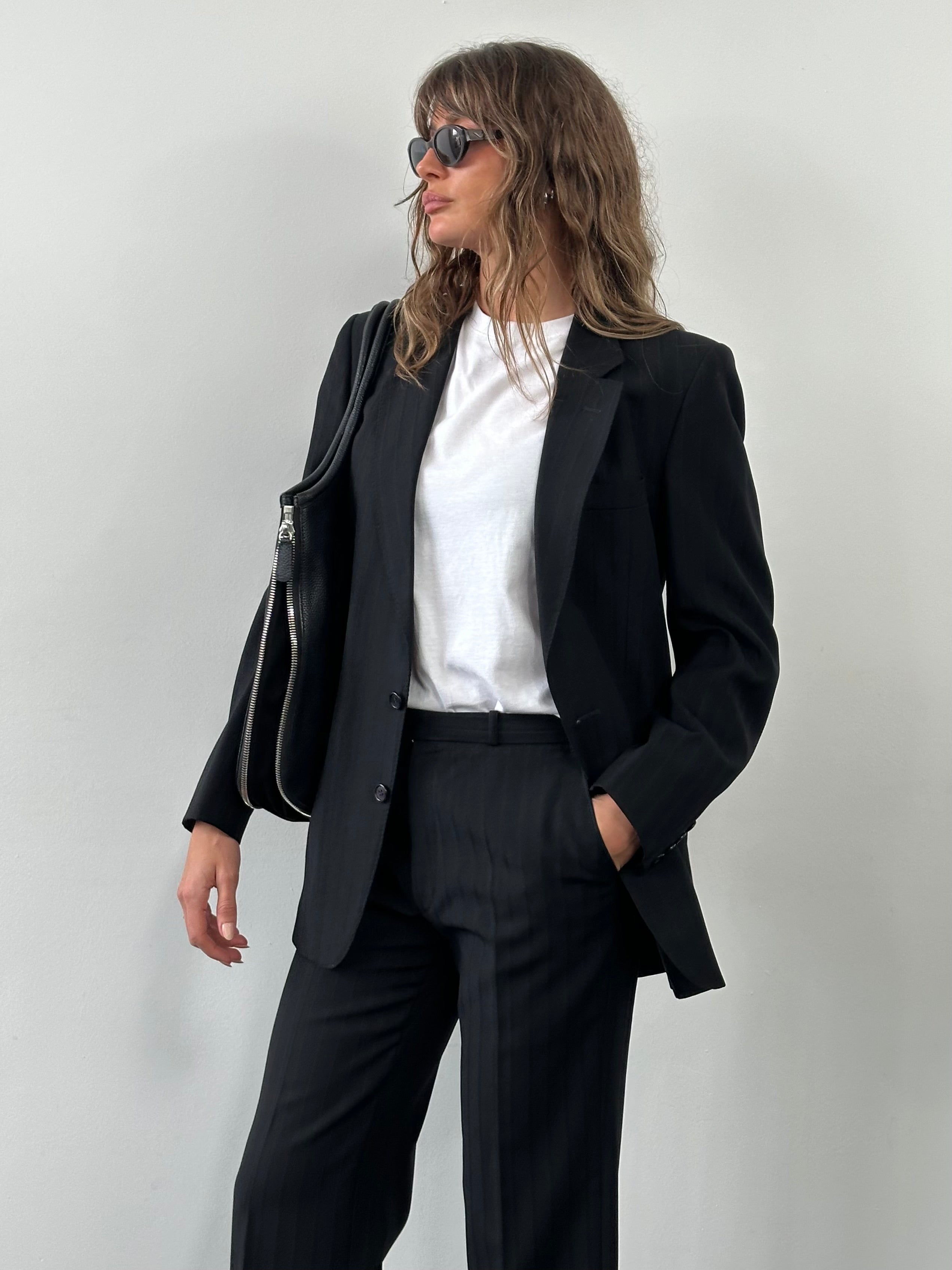 Christian Dior 1990s pure wool stripe suit, single-breasted jacket with notch lapels, displayed on a hanger.