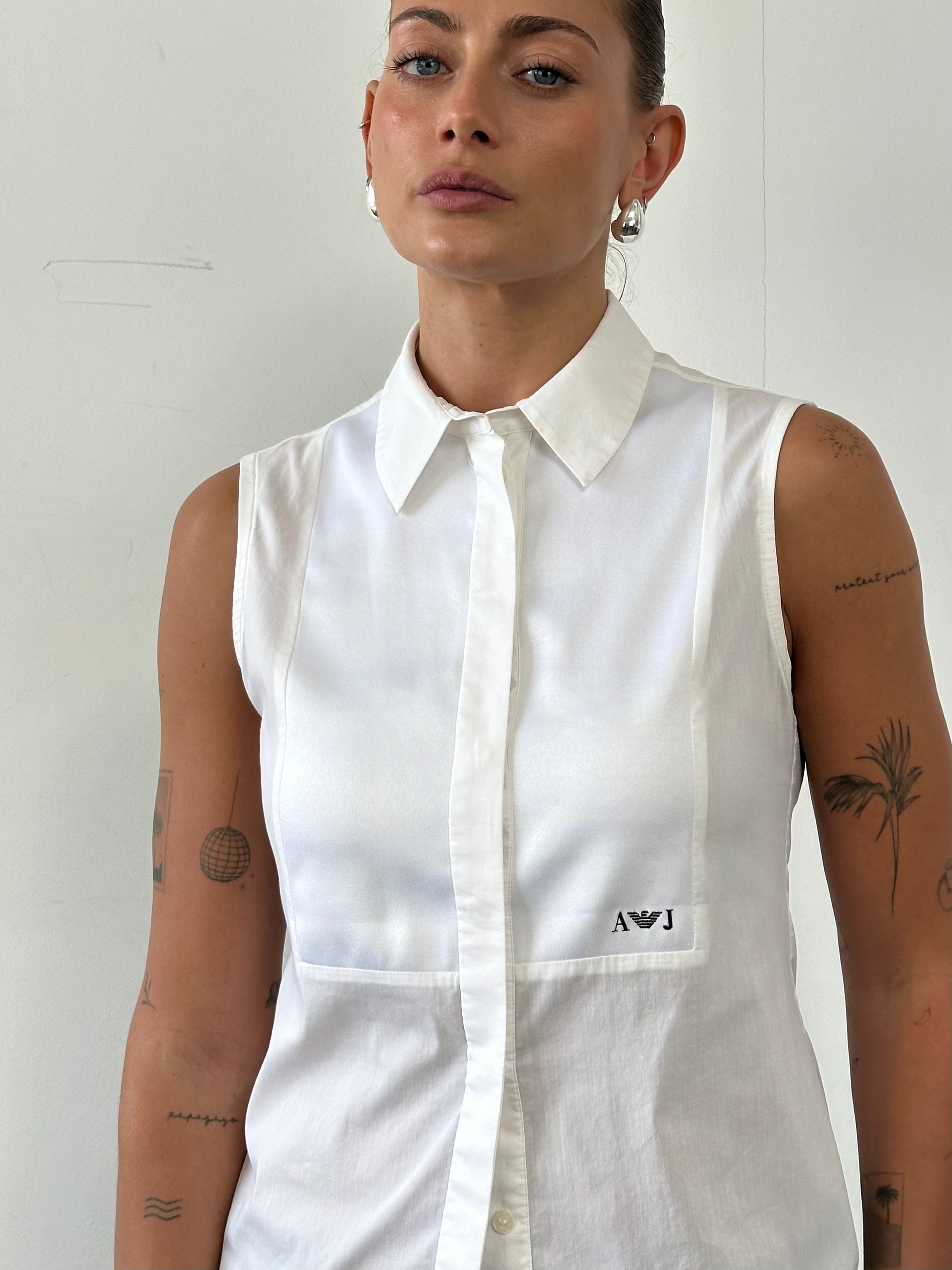 Armani Jeans sleeveless shirt in size S, lightweight fabric with a classic design, shown on a neutral background.