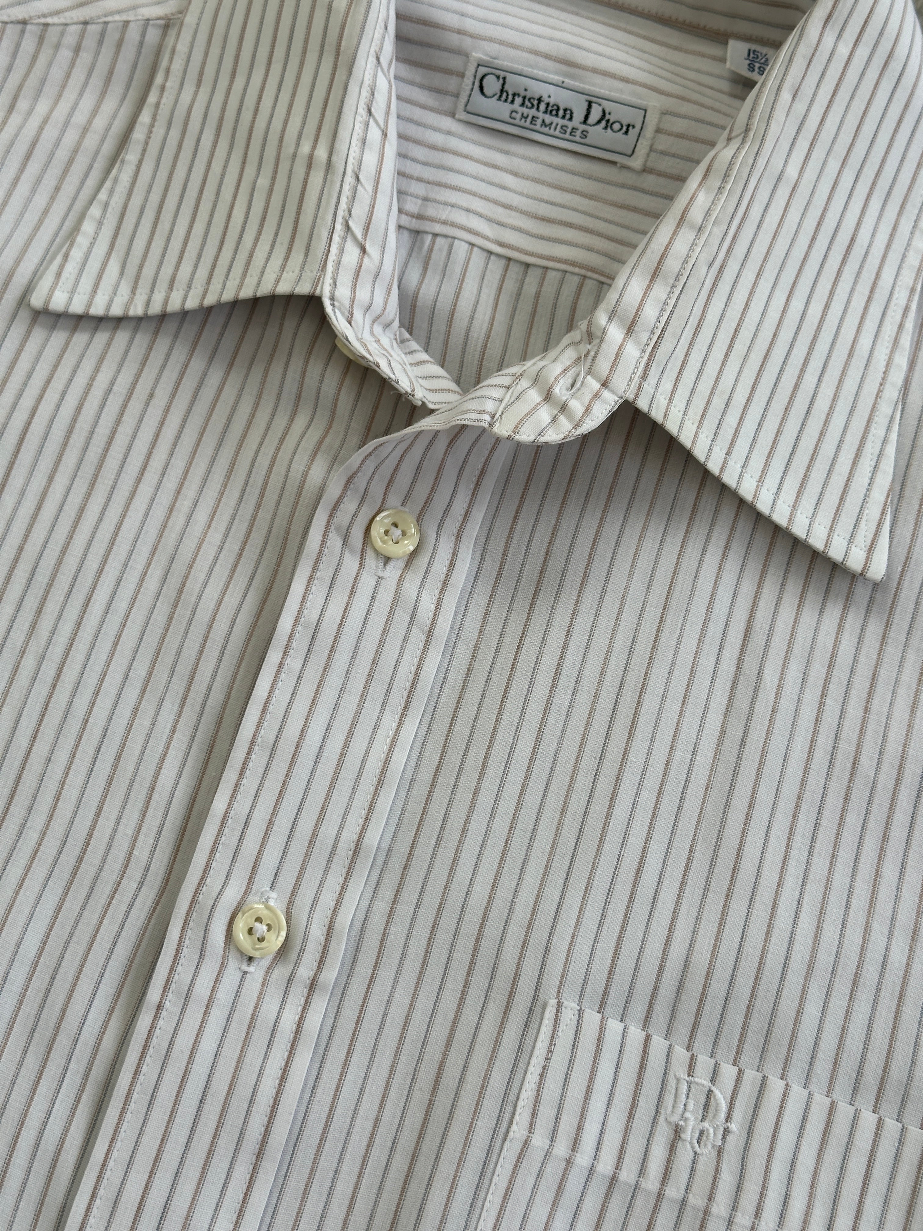Christian Dior striped cotton logo shirt in size M/L, featuring iconic branding and stylish design, displayed on a hanger.