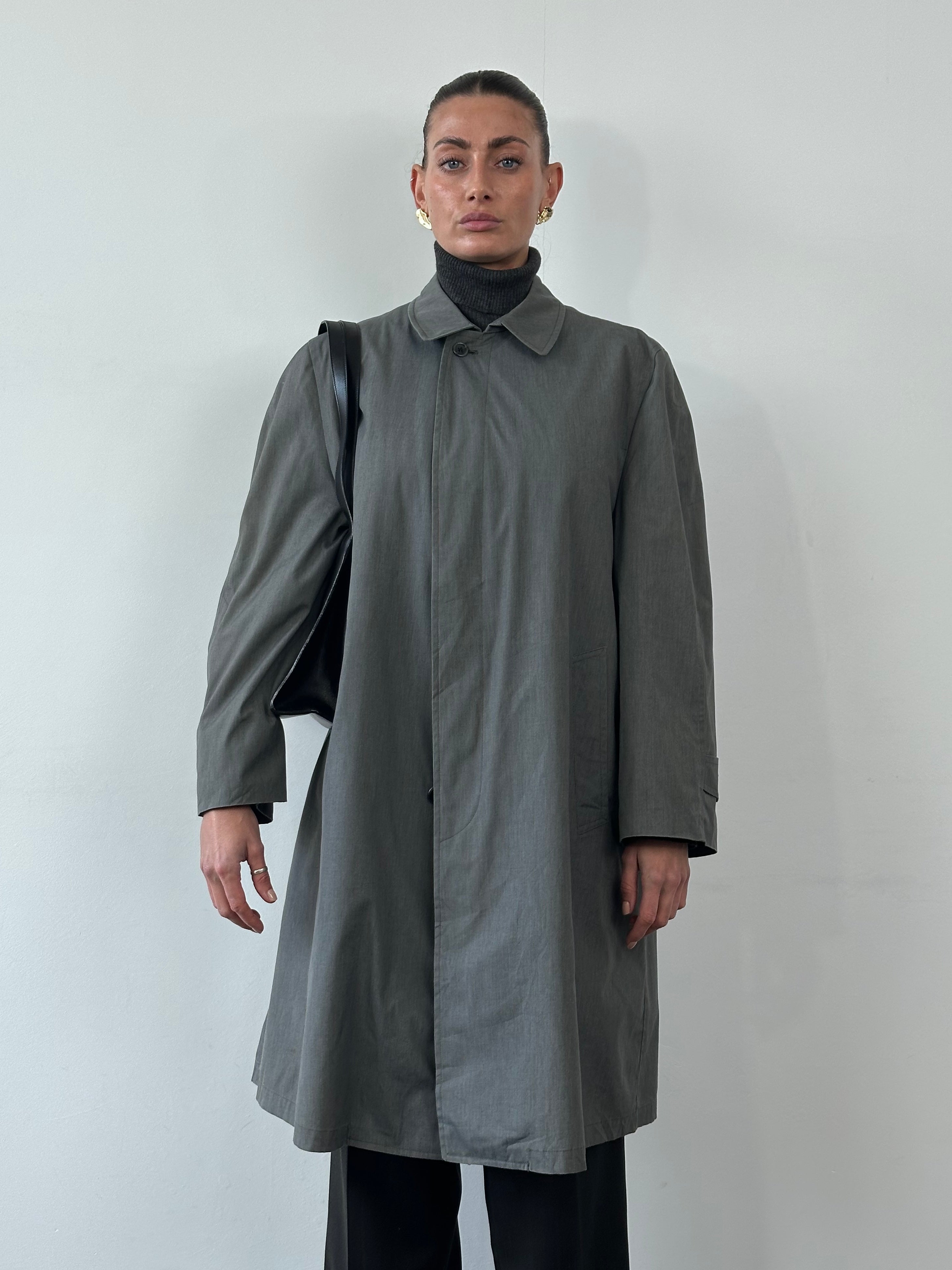 London Fog XL trench coat with concealed placket, classic beige fabric, and tailored fit, displayed on a hanger.