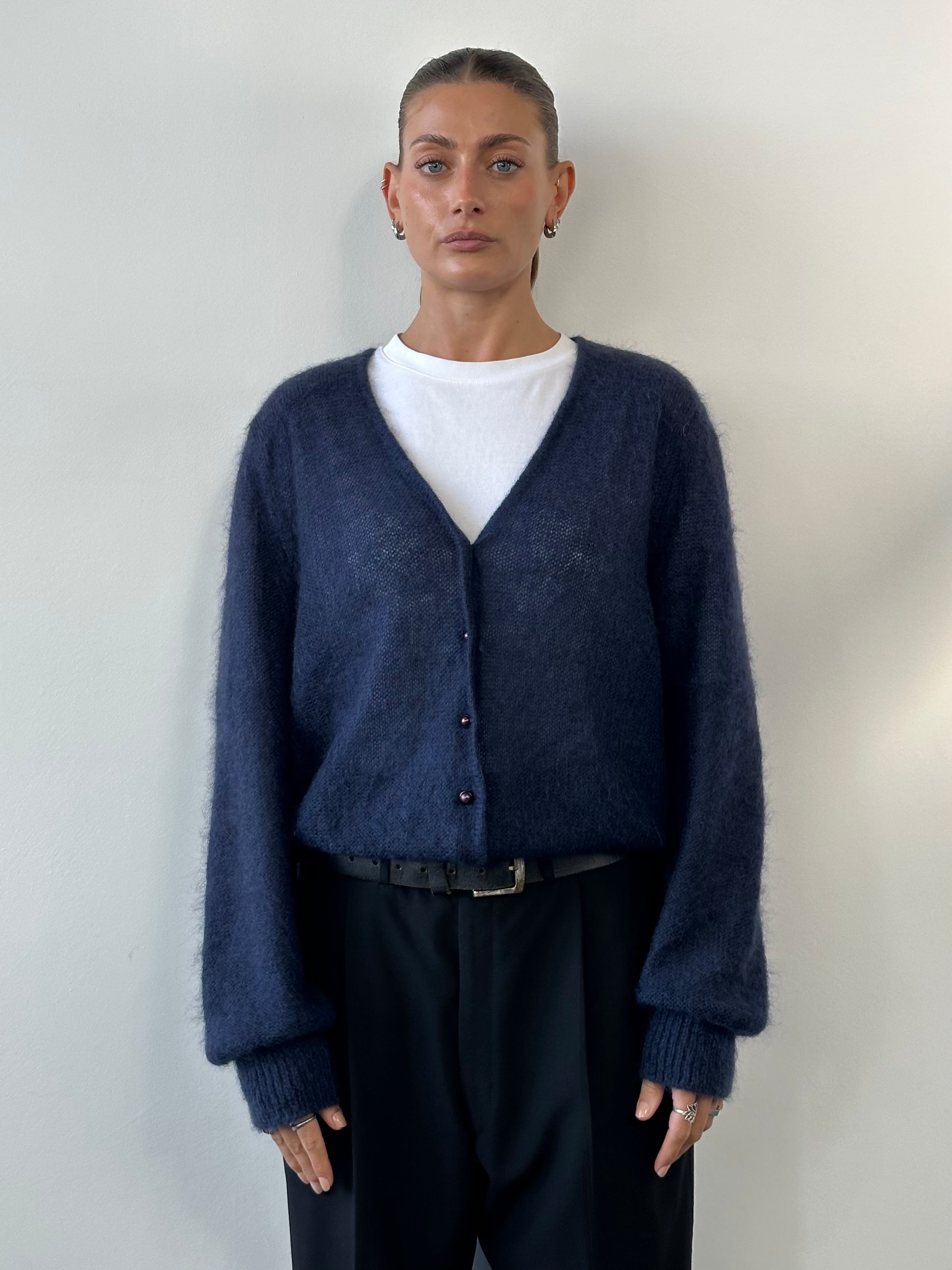 Vintage Italian vintage mohair cardigan in size M with a soft, textured knit and classic design, displayed on a neutral background.