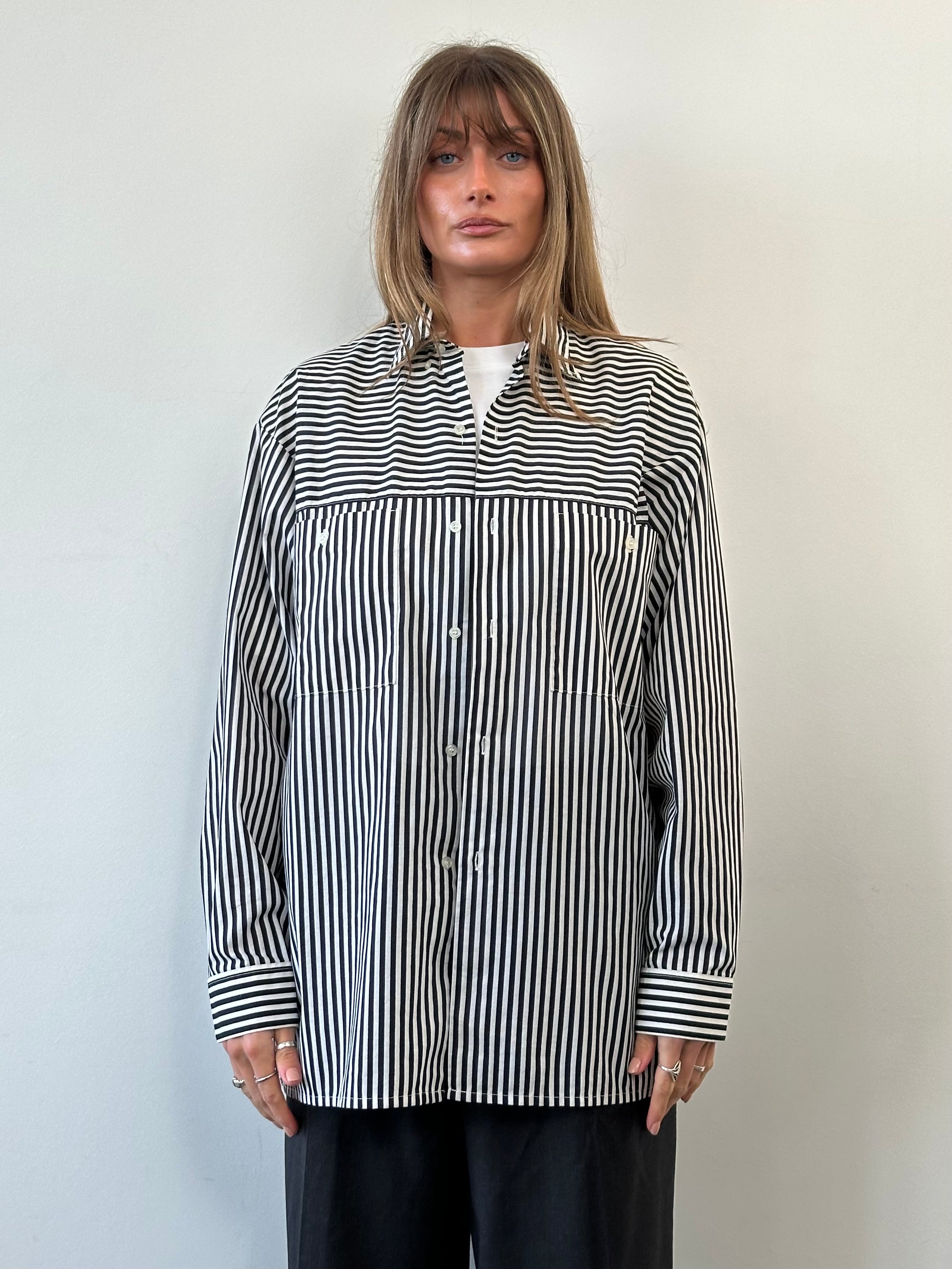 Vintage brand vintage stripe shirt in XL size, showing its classic design with colorful horizontal stripes and button-front style.