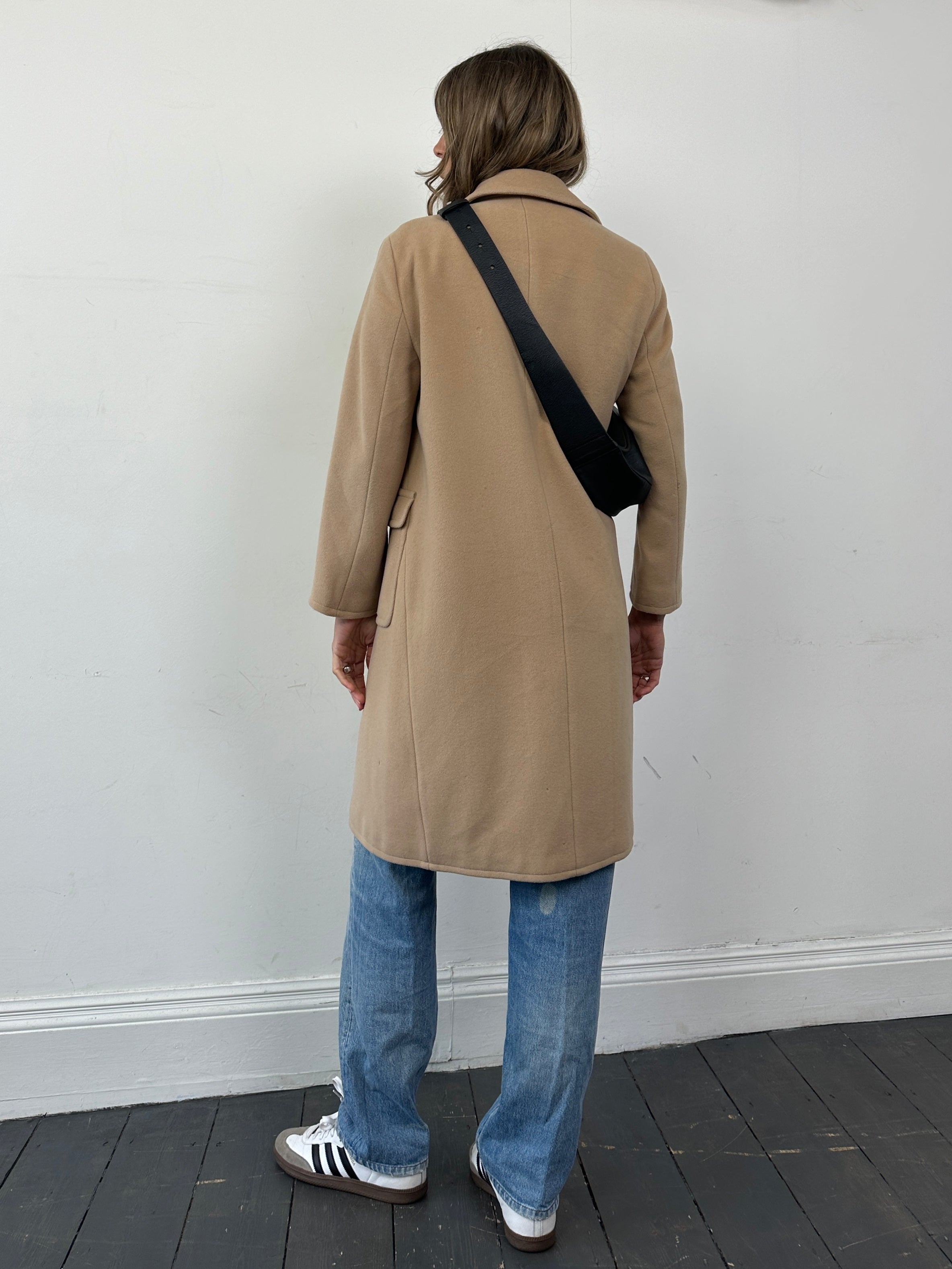 Hugo Boss Pure Wool Single Breasted Coat in size S, stylish navy coat with classic lapel collar and tailored fit, displayed on a hanger.