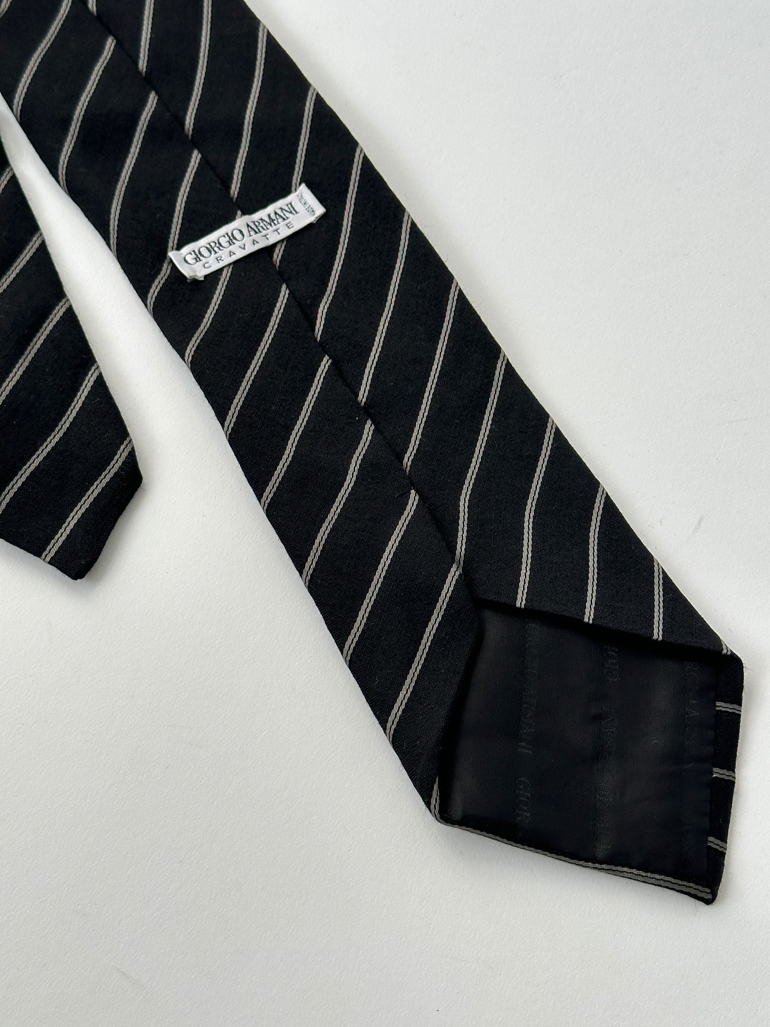 Giorgio Armani stripe silk wool tie featuring classic pattern and elegant design, ideal for formal or professional attire.