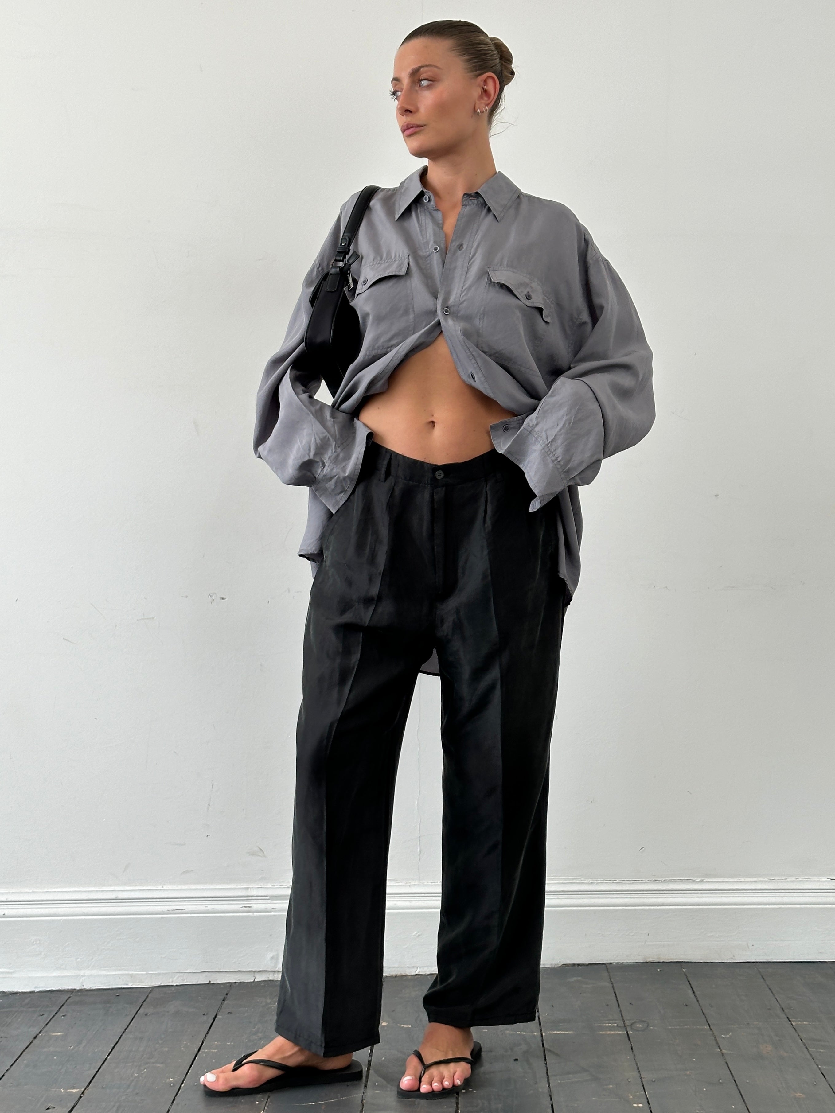 Vintage pure silk high waisted straight leg trousers in W32, displayed on a hanger with a neutral background.