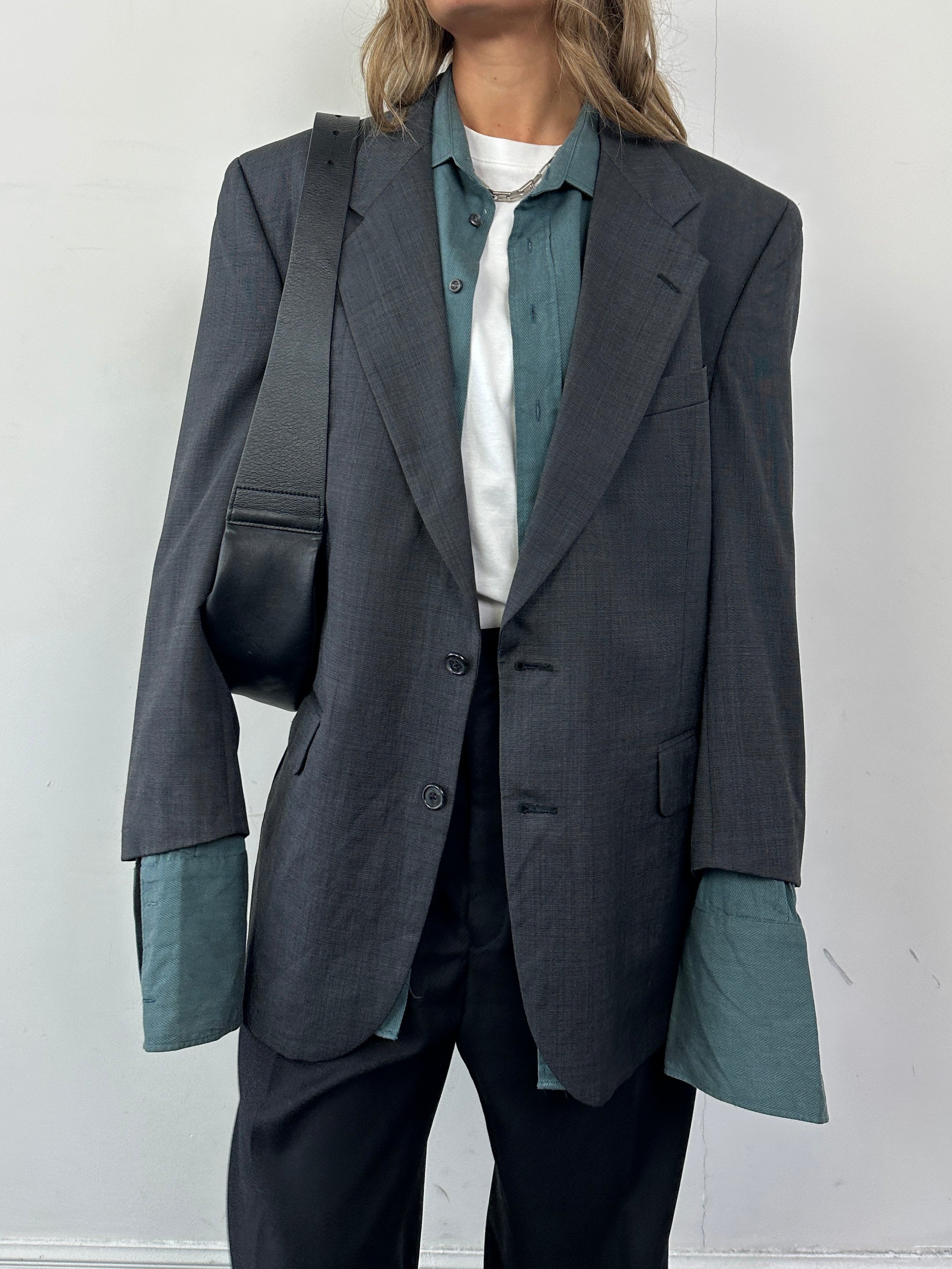 Christian Dior Le Connaisseur pure wool single-breasted blazer in black, tailored fit with notch lapel and structured design.