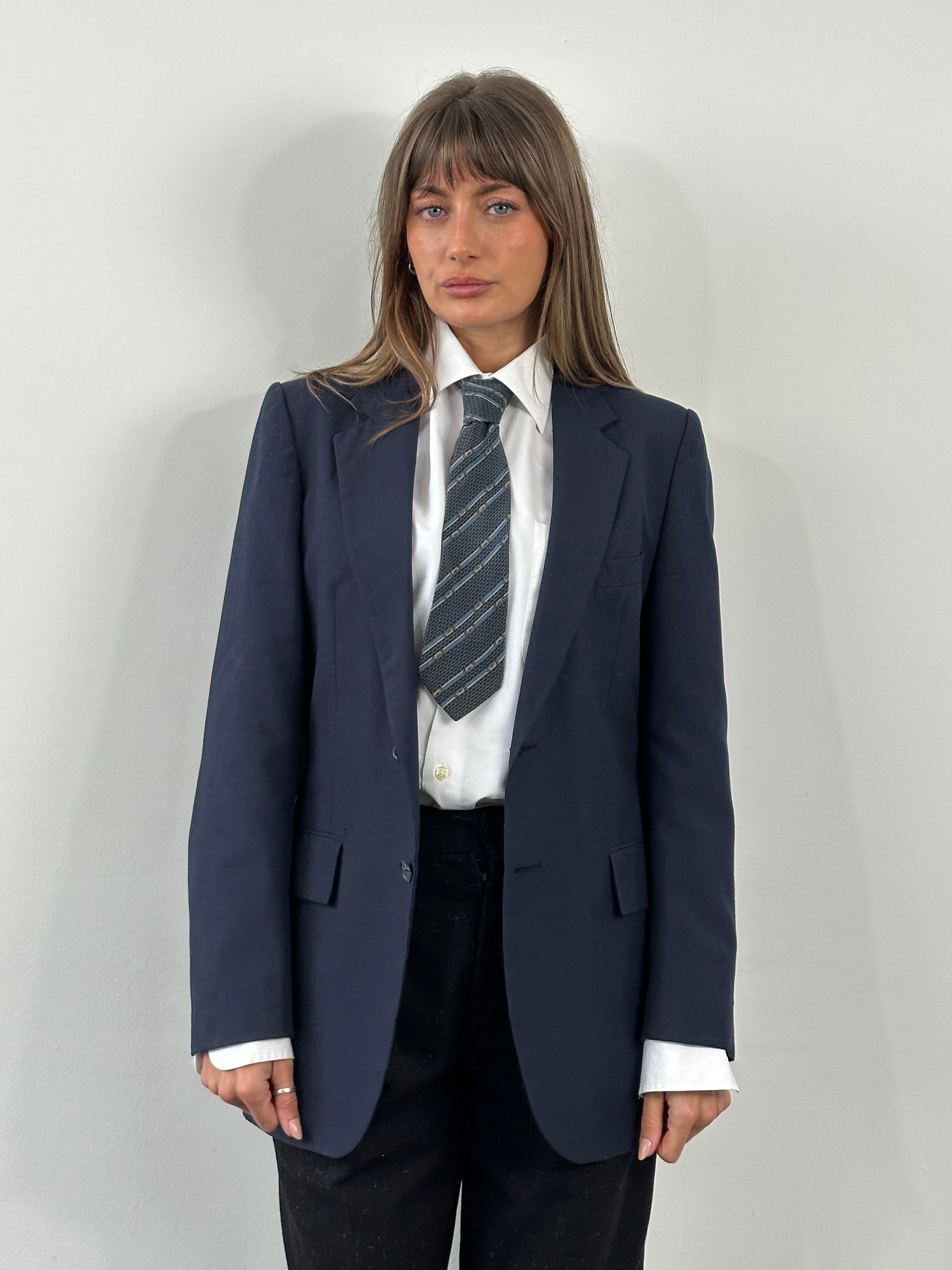 Yves Saint Laurent 1990s pure wool single-breasted blazer in size 36R/S, shown on a hanger with classic tailored design.