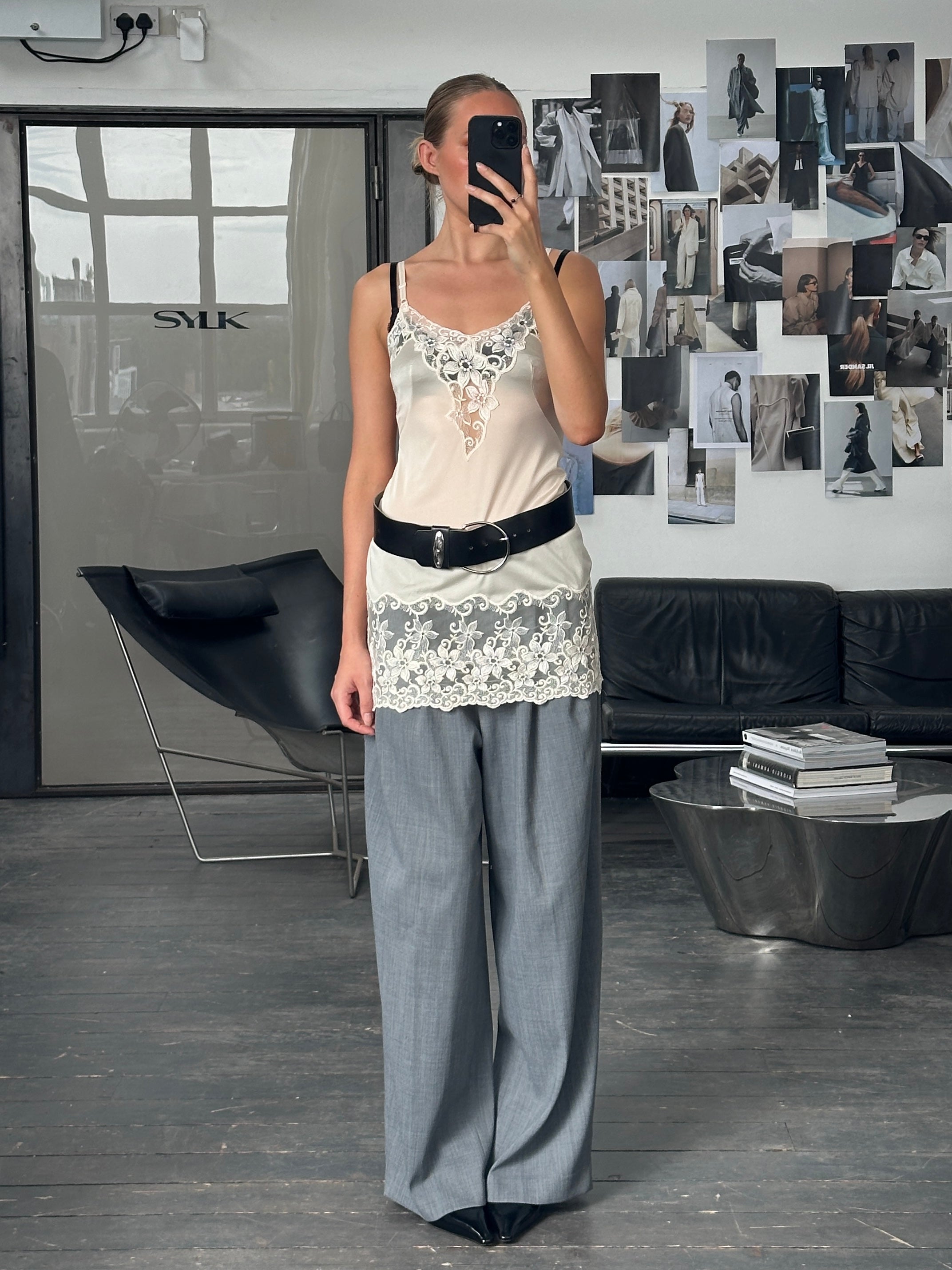 Vintage 1990s lace sheer mini slip dress in XS/S, featuring delicate fabric and vintage style, perfect for retro-inspired fashion.