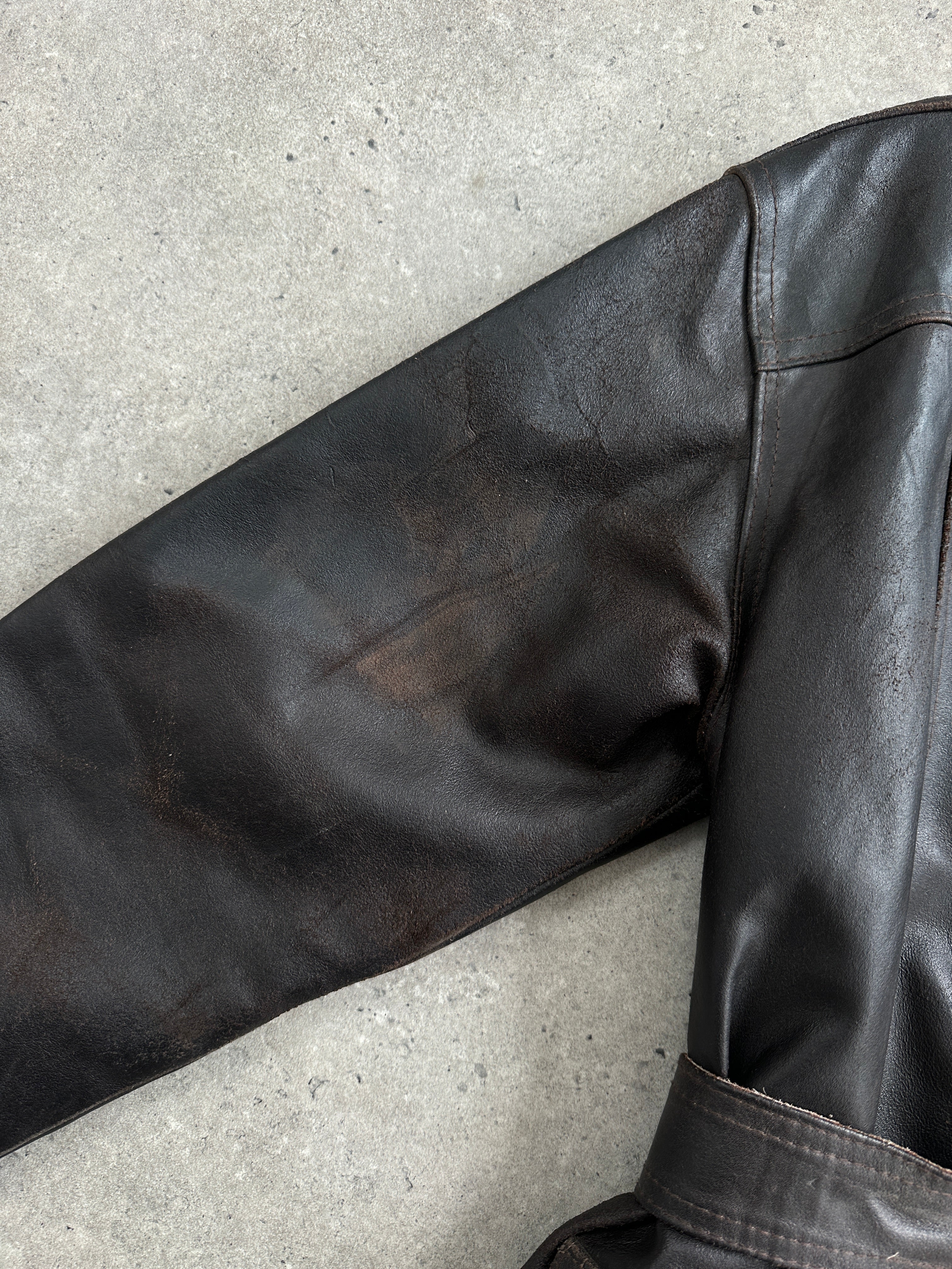 Vintage Italian 1980s belted leather jacket, size M, featuring classic design and rich brown leather.