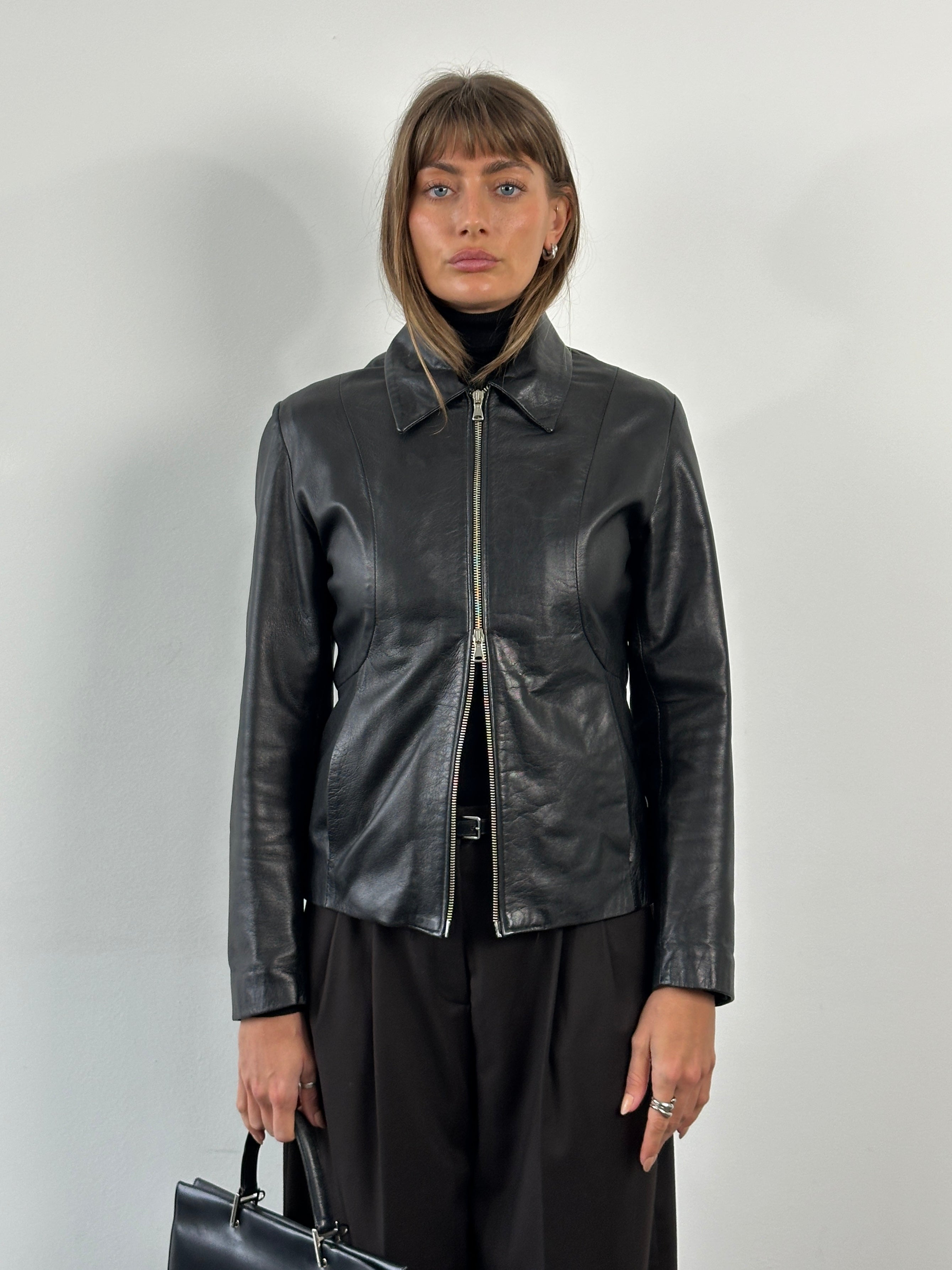 Italian Vintage 1990s double zip leather jacket, slim fit, brown leather with silver zippers, classic retro style.