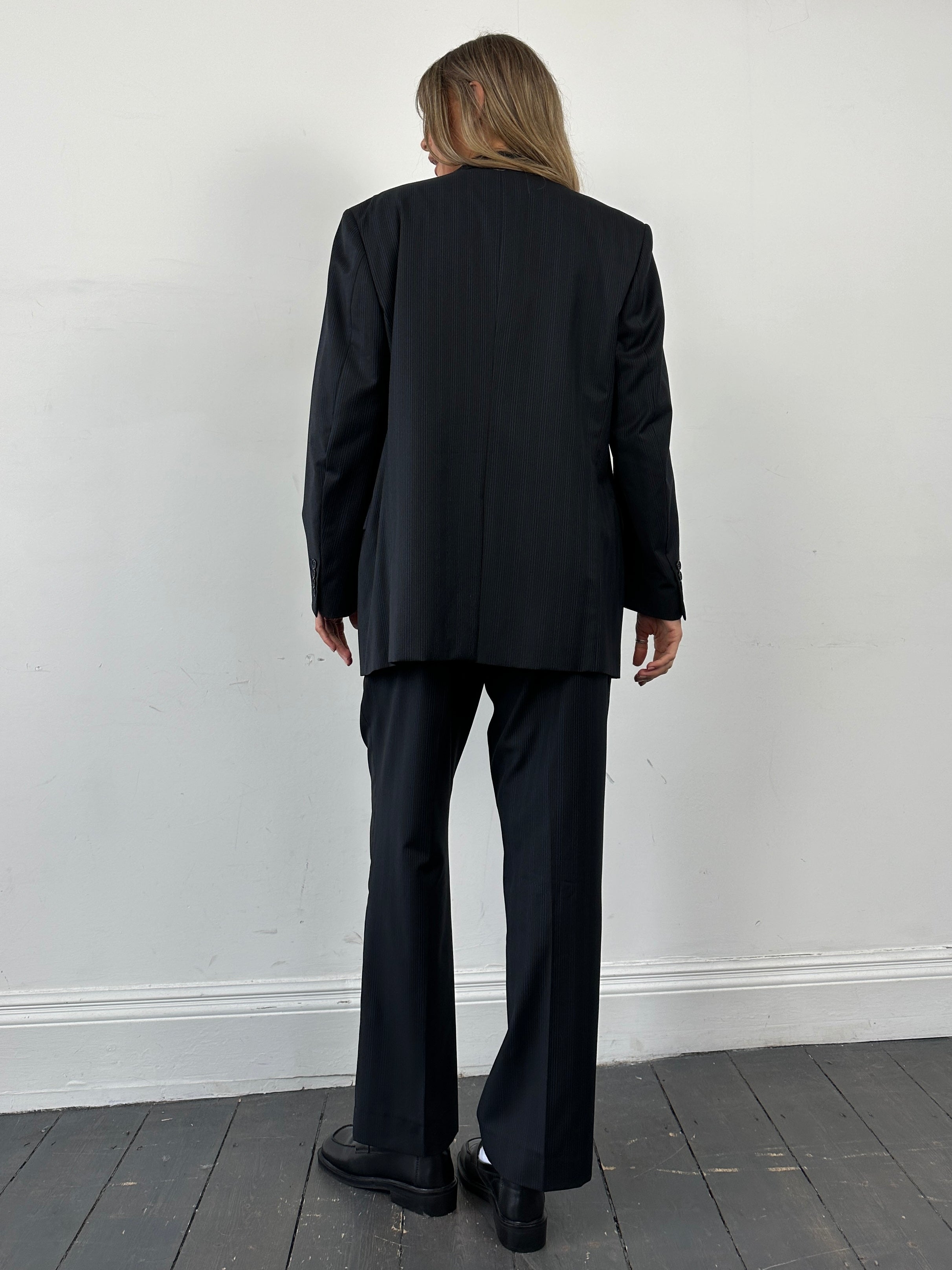 Yves Saint Laurent pinstripe pure wool single-breasted suit jumpsuit in size 40S/W32, featuring tailored lapels and classic pinstripe pattern.