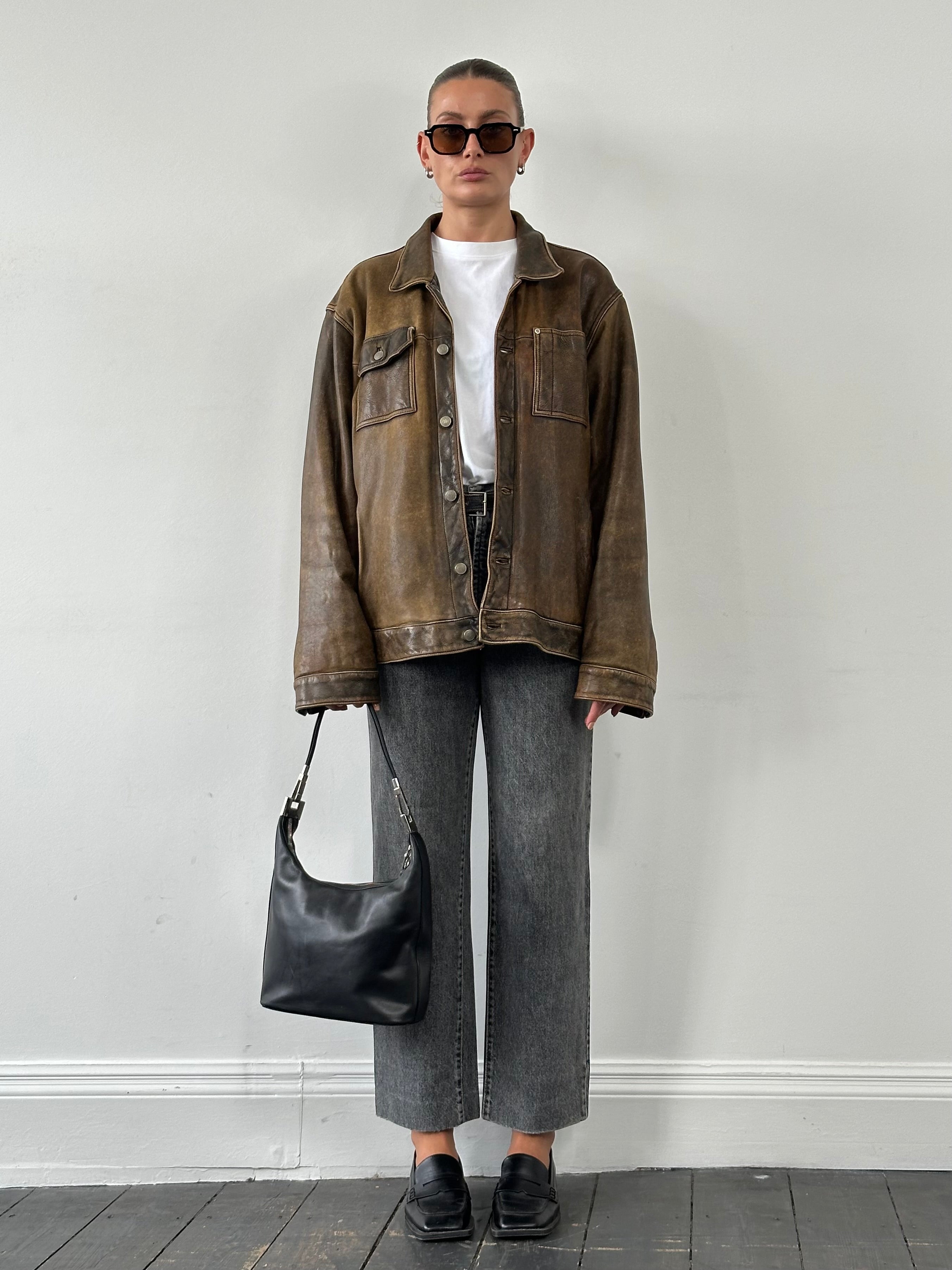 Vintage Italian 1990s high-waisted straight leg denim jeans, W28, showing classic blue denim with a vintage fit and style.