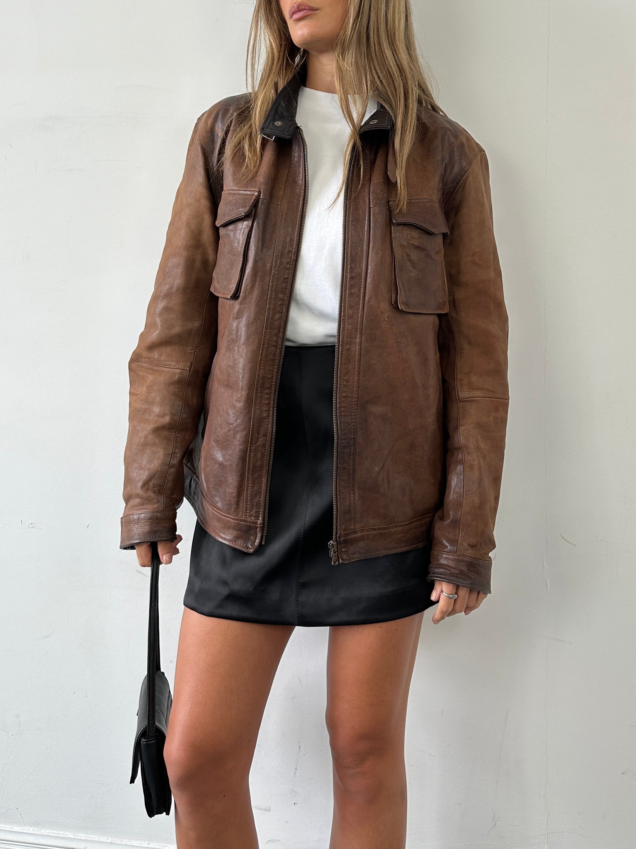 Vintage Italian vintage aged leather jacket in size L, featuring classic design and rich brown color.