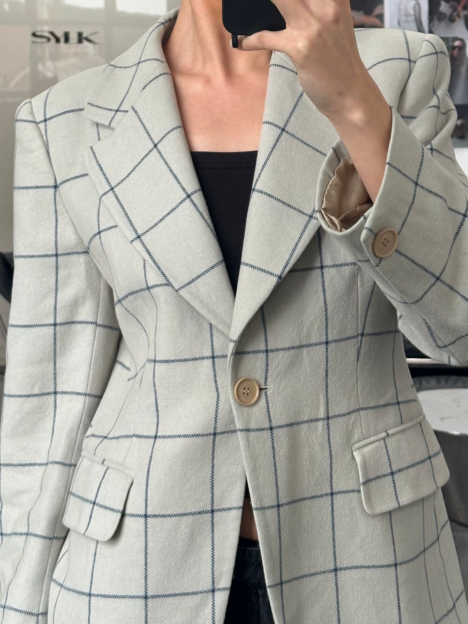 Emporio Armani 1990s wool check blazer in size M, tailored fit with classic plaid pattern, featuring notch lapels and front buttons.