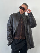 Jaeger 1990s high neck leather jacket with concealed placket in black, size XL, featuring smooth leather and modern design.